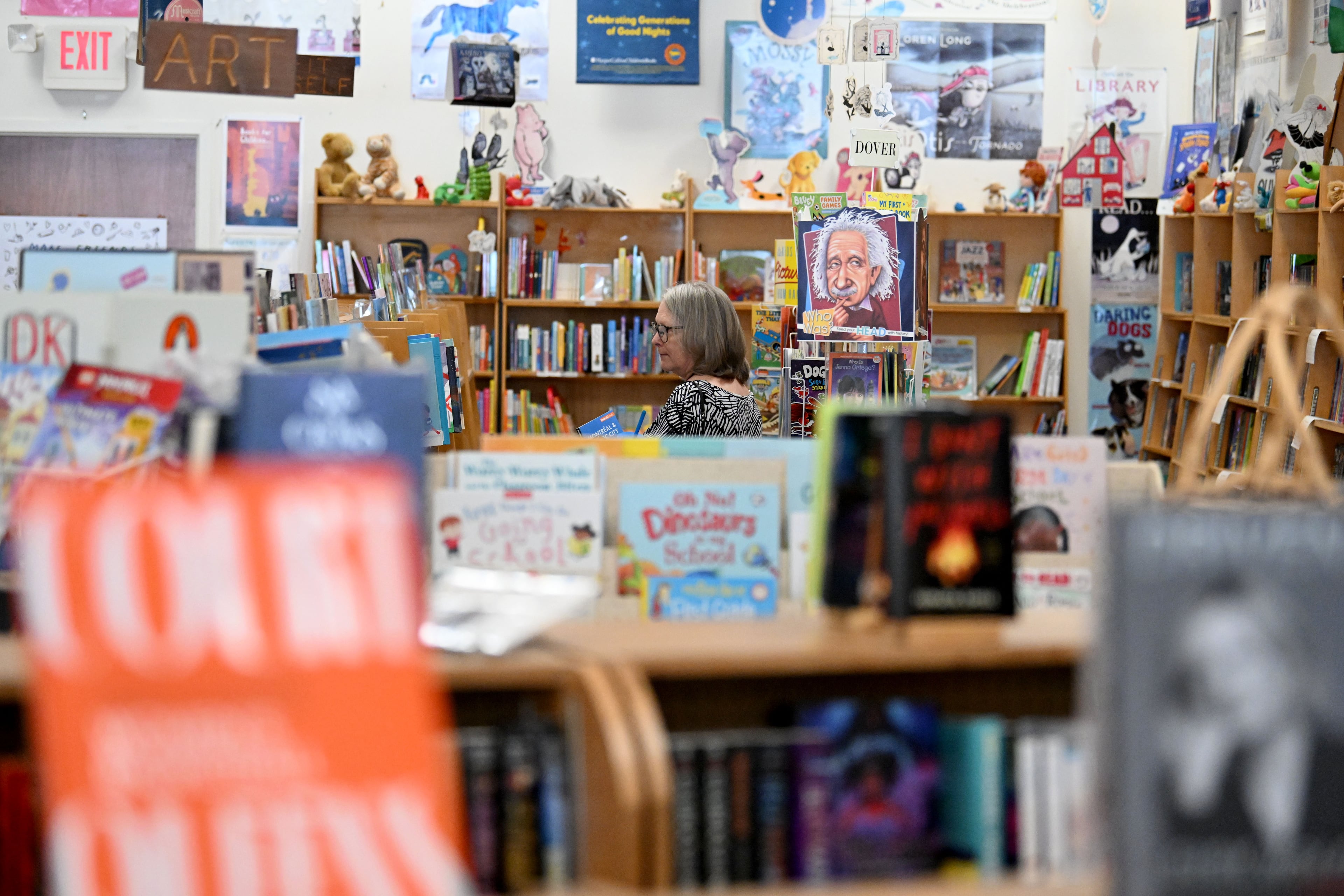 Barb Bornemeier browses books at Tall Tales Book Shop in the Toco Hills neighborhood on Wednesday, July 8, 2026, in Atlanta. (Hyosub Shin/AJC)