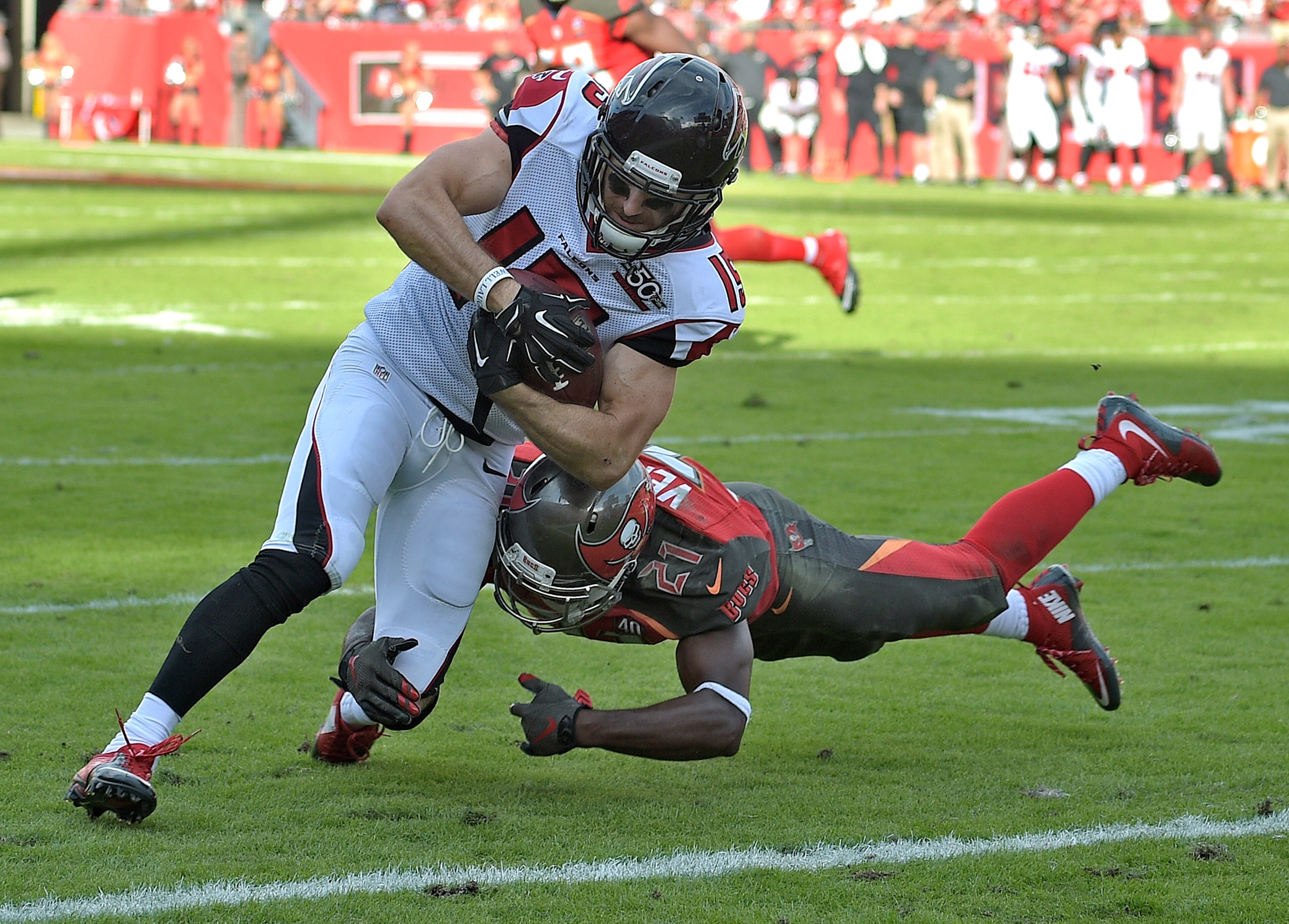 Atlanta Falcons wide receiver Nick Williams eludes Tampa Bay Buccaneers cornerback Alterraun Verner (21) as he scores on a 5-yard touchdown reception during the fourth quarter of an NFL football game Sunday, Dec. 6, 2015, in Tampa, Fla. (AP Photo/Phelan M. Ebenhack)