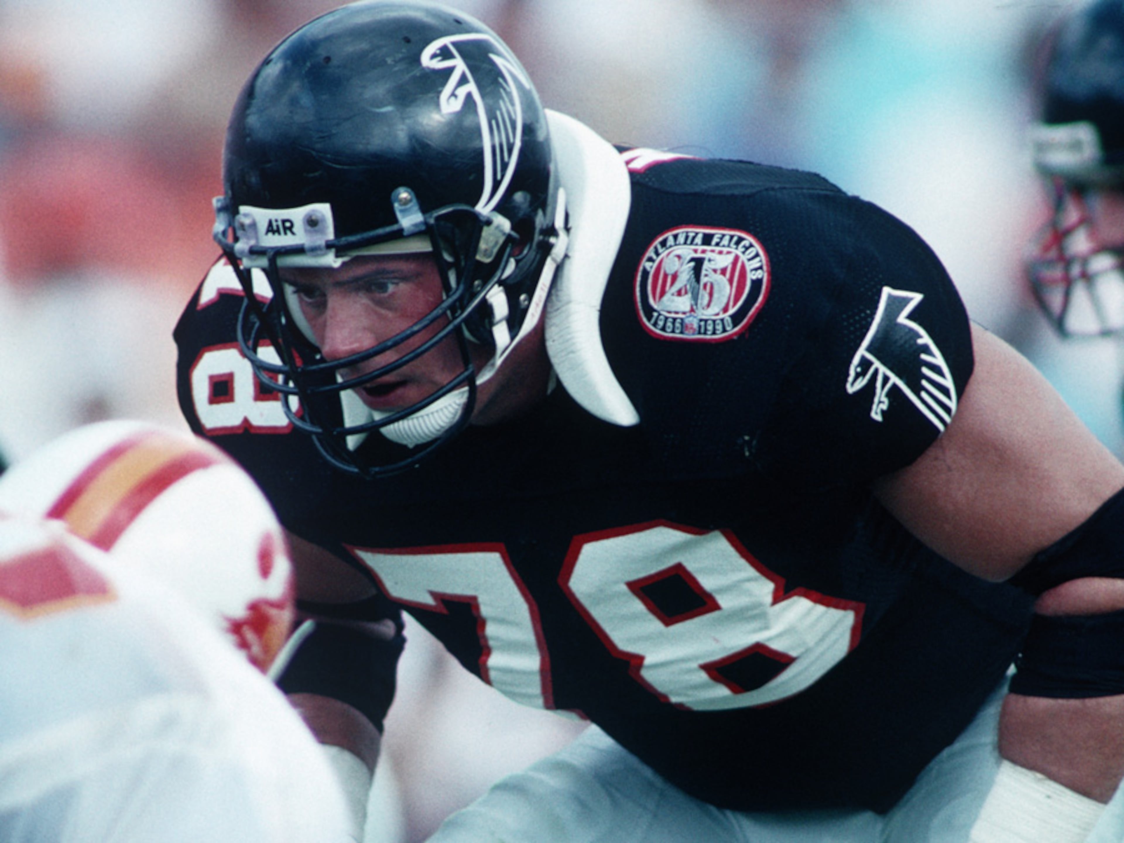 Tackle Mike Kenn (78) of the Atlanta Falcons sets for a play against the Tampa Bay Buccaneers in 1990. (AP Photo / Al Messerschmidt)