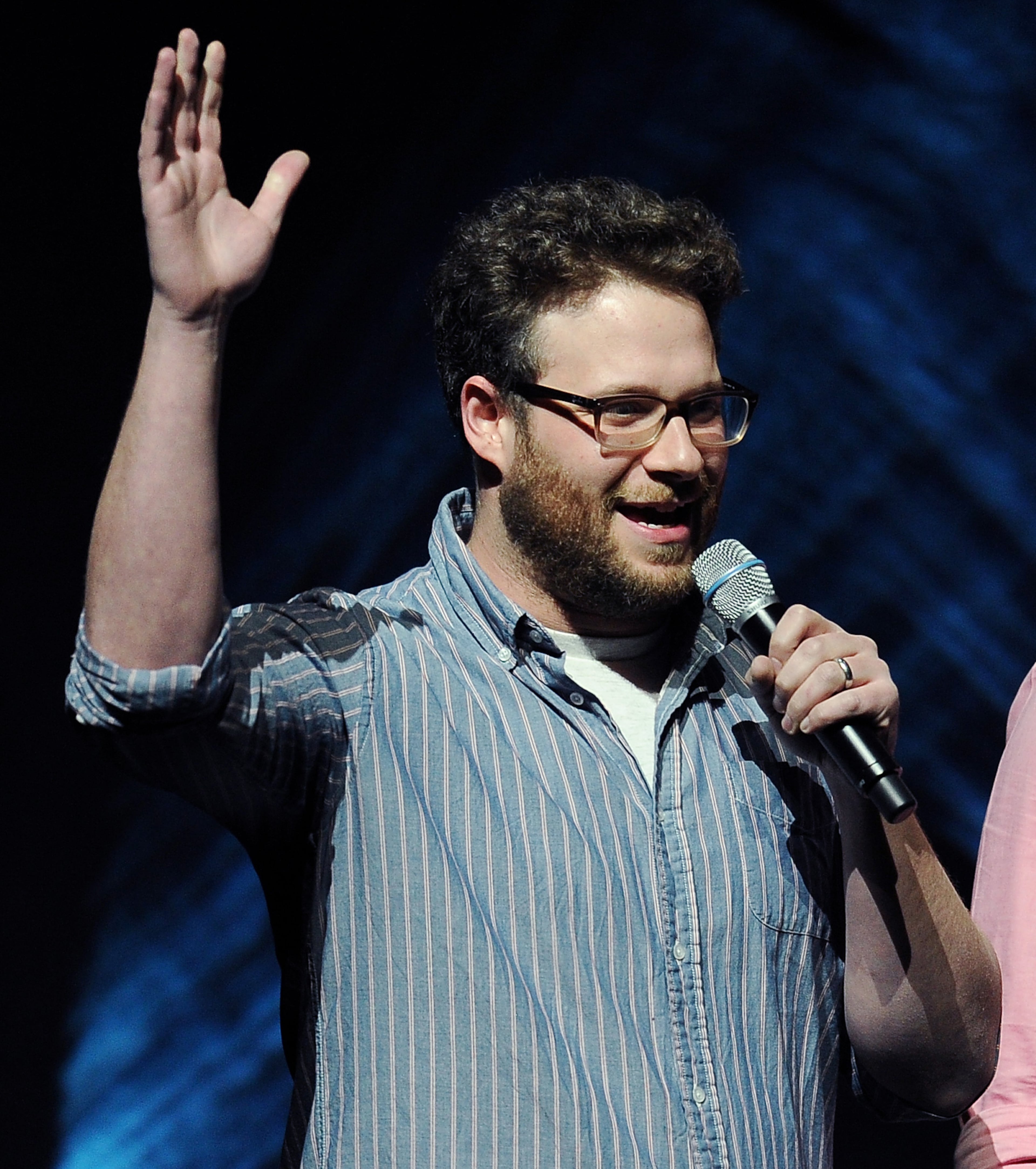Seth Rogen, a cast member in "Neighbors," waves to the audience before a screening of the film on the second day of CinemaCon 2014, on Tuesday, March 25, 2014, in Las Vegas. (Photo by Chris Pizzello/Invision/AP)