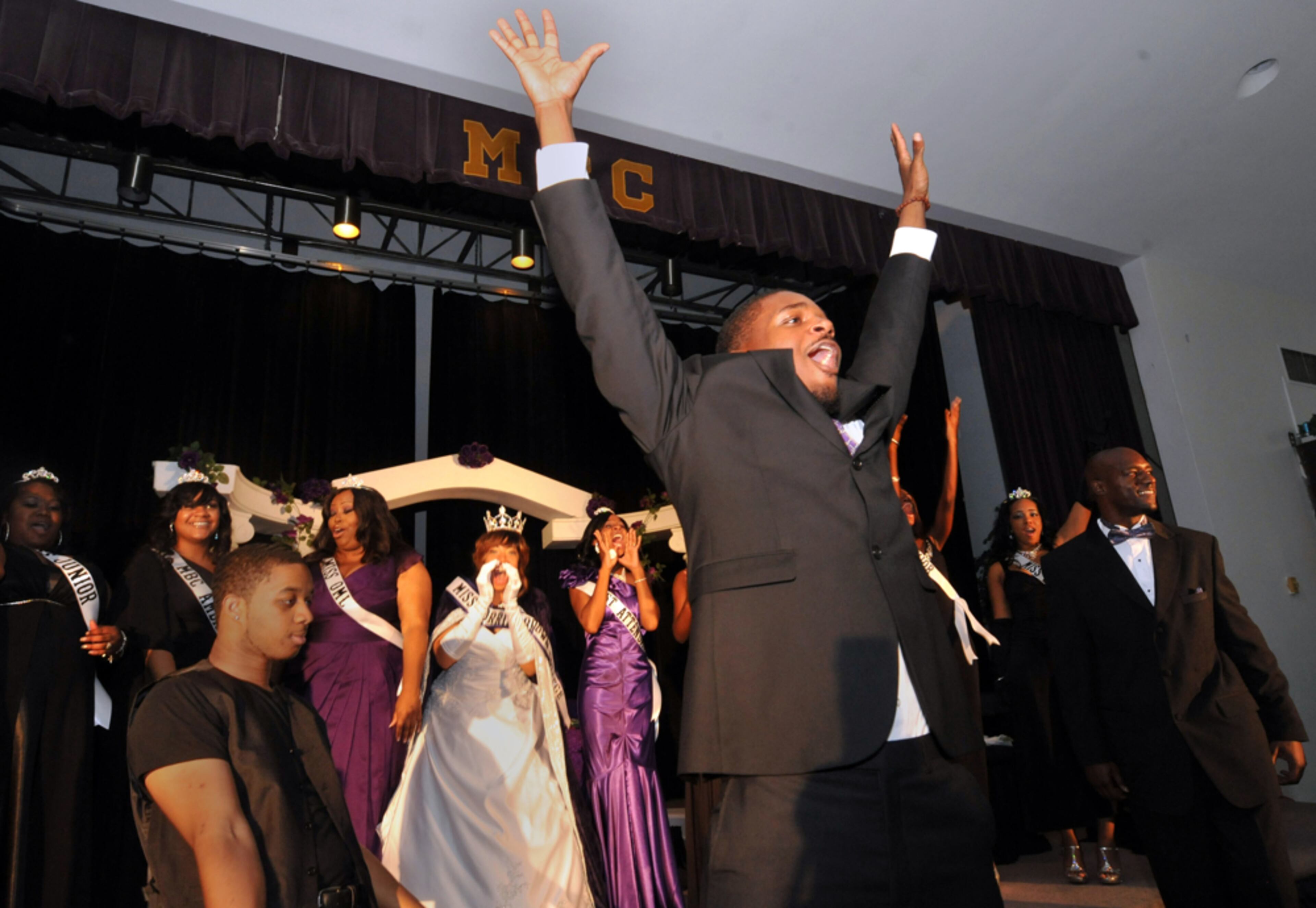 Most HBCU college alumni are fiercely loyal to their schools and for one of the original Atlanta University Center schools, Morris Brown alums are no different. Even though the school has fallen on very hard times, they still managed to hold one of their most memorable events. October 18, 2012 ATLANTA Morris Brown sophmore class president Rashad Davis-Gladney celebrates at the end of the Miss Morris Brown coronation ceremony Thursday October 18. On Aug. 25, Morris Brown College filed for Chapter 11 Bankruptcy protection, giving them 90 days to come up with a plan that would prevent parts of the heavily indebted school from being sold at action. Saturday, October 20 marks day 57, but it also marks Homecoming for the school that many people would argue has very little to celebrate. Yet, alums are gearing up to revisit the campus this week to reflect on the past - although there is little indication that the celebration will lead to anything - unless, as economist Bill Dickens said, "A man on a white horse comes into the stadium at half-time with a $30 million check." KENT D. JOHNSON / KDJOHNSON@AJC.COM NIKON D3, ISO 2000, 1/60, f9, 19mm