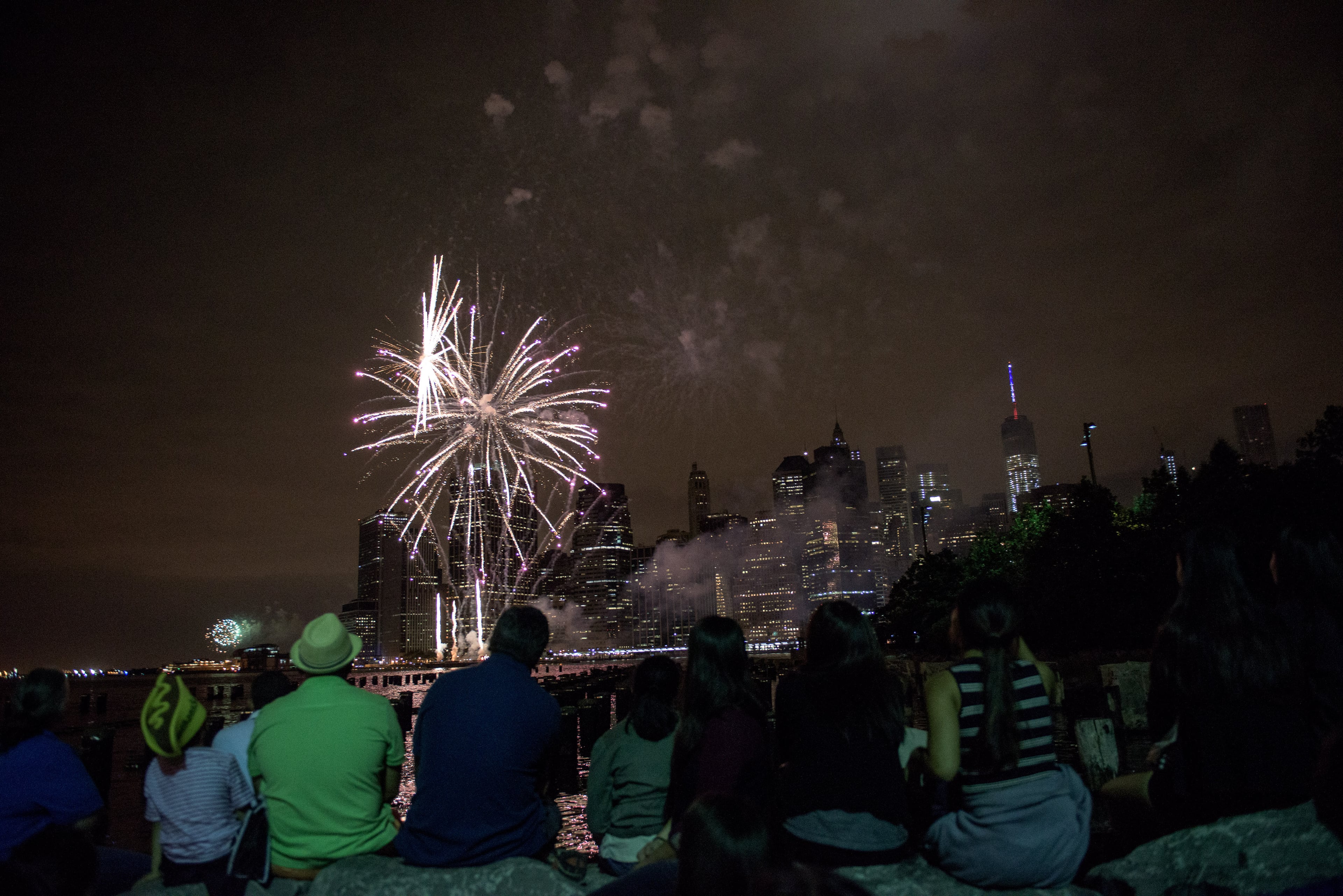 NEW YORK, NY - JULY 4: People watch Macy's Fourth of July Fireworks from Brooklyn Bridge Park on July 4, 2015 in the Brooklyn borough of New York City. The celebrations mark the nation's 239th Independence Day. (Photo by Andrew Renneisen/Getty Images)