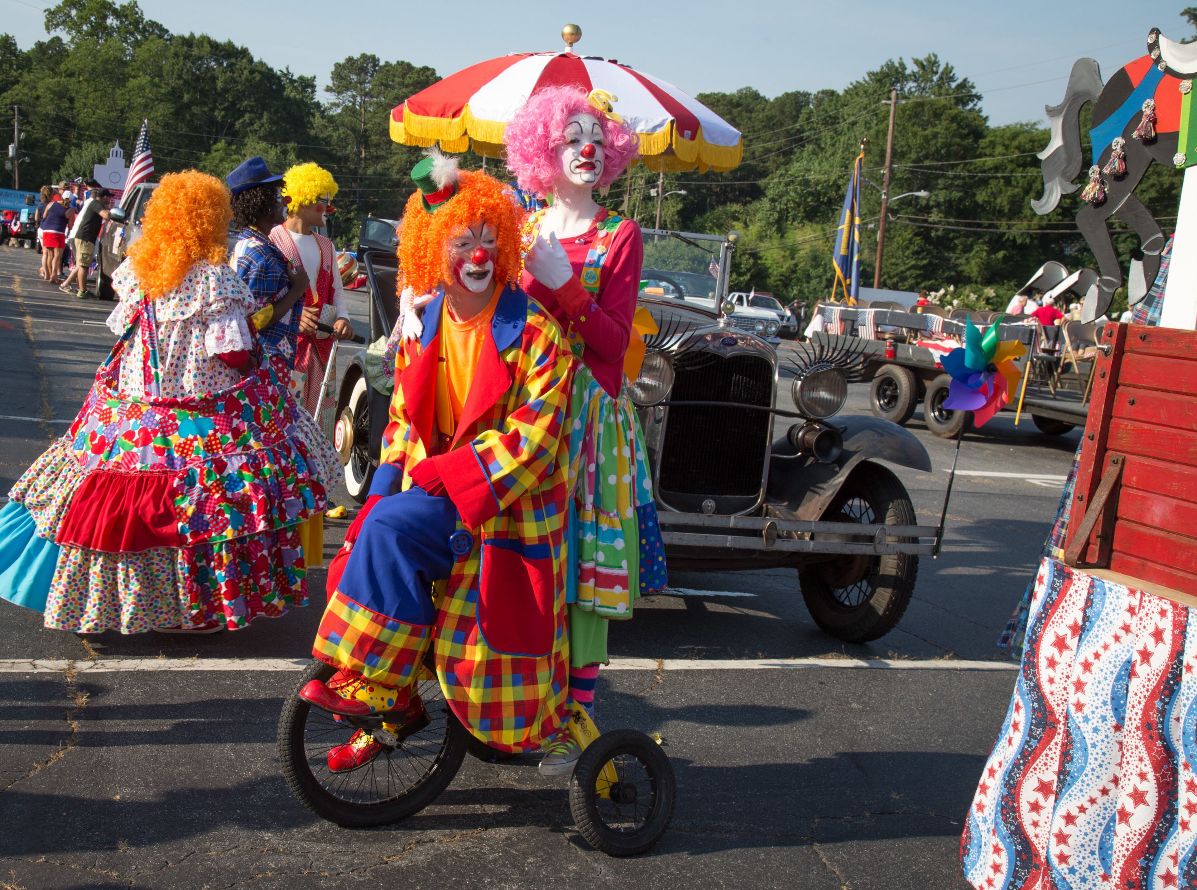 Clowns from the clowns youth group at the Grace Life Church, get ready to line up for the Marietta Freedom Parade on Tuesday, July 4, 2016, In Marietta, GA. STEVE SCHAEFER / SPECIAL TO THE AJC