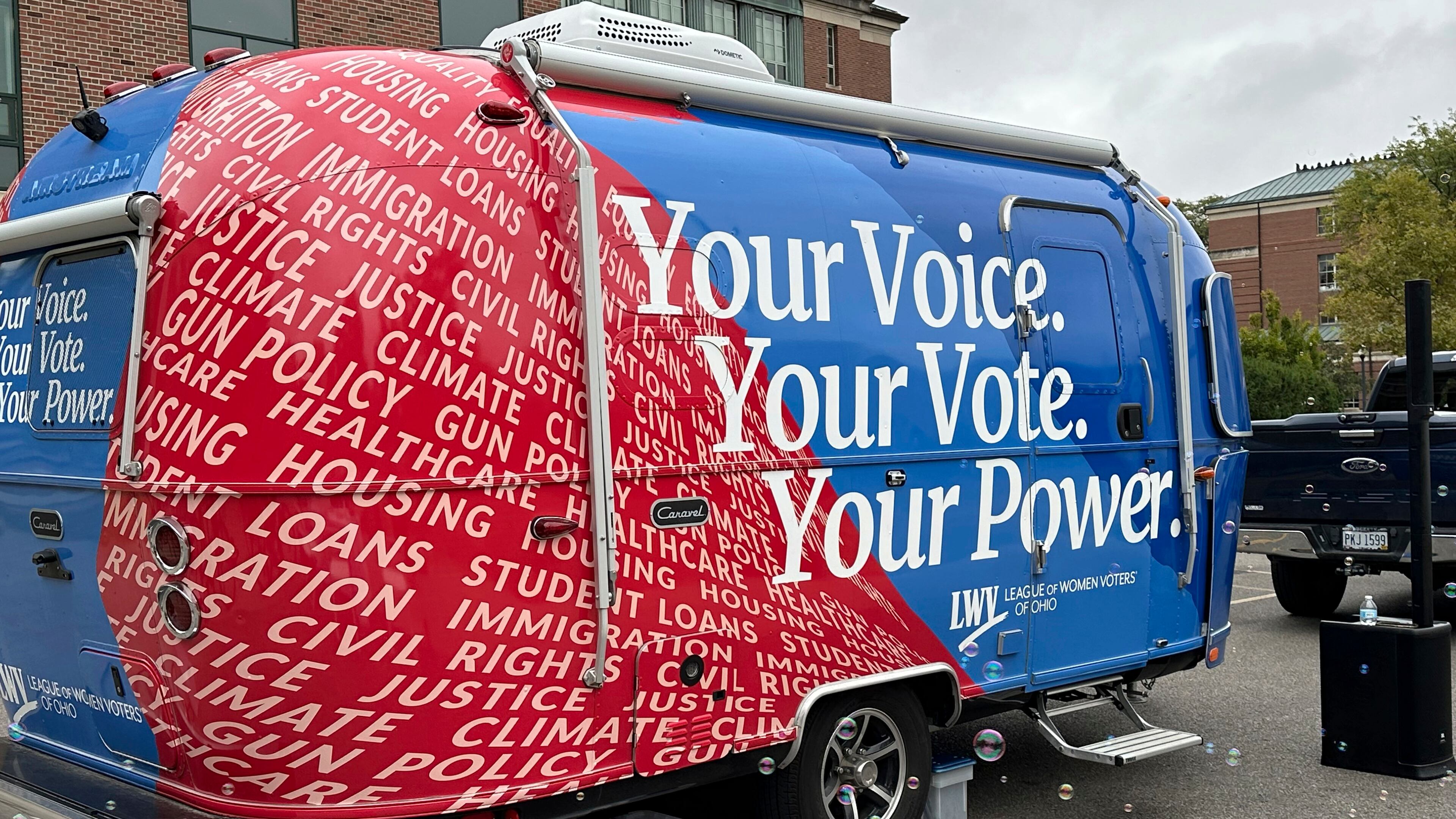Thanks to activists a century ago, women earned the right to vote in 1920, and groups like the League of Women Voters — here working to register student voters in Ohio in 2024 — have continued to advocate for women's equality. (Julie Carr Smyth/AP 2024)