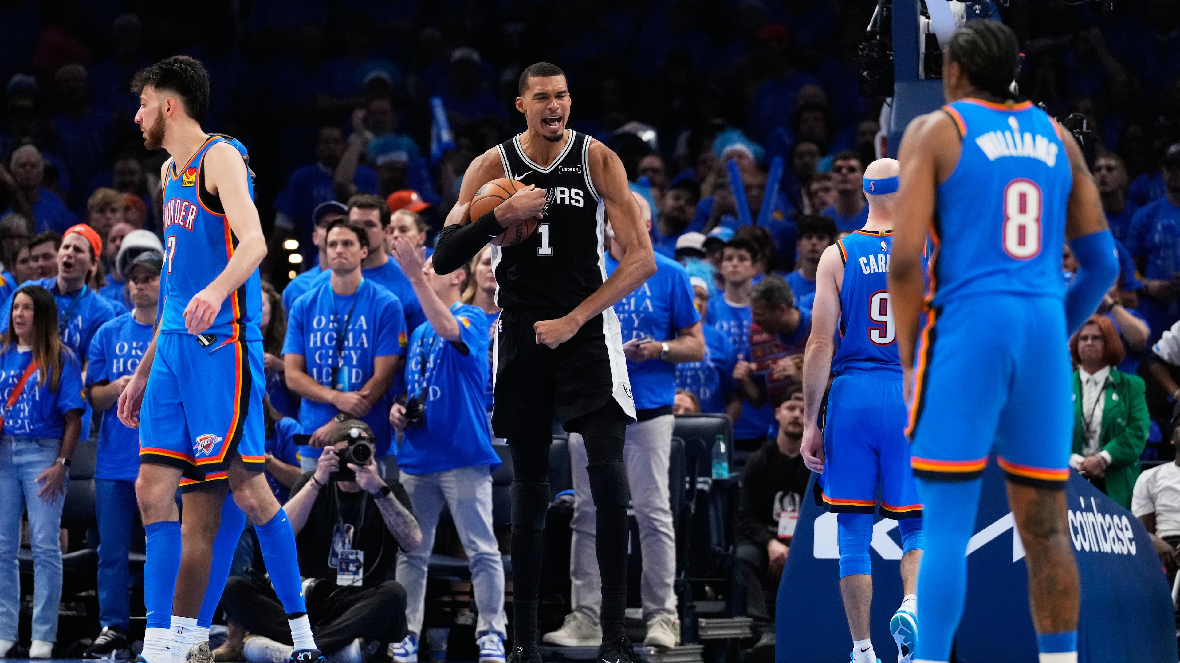San Antonio Spurs forward Victor Wembanyama (1) celebrates after a dunk during the second overtime of Game 1 in a third-round NBA basketball playoffs series against the Oklahoma City Thunder Monday, May 18, 2026, in Oklahoma City. (AP Photo/Tony Gutierrez)