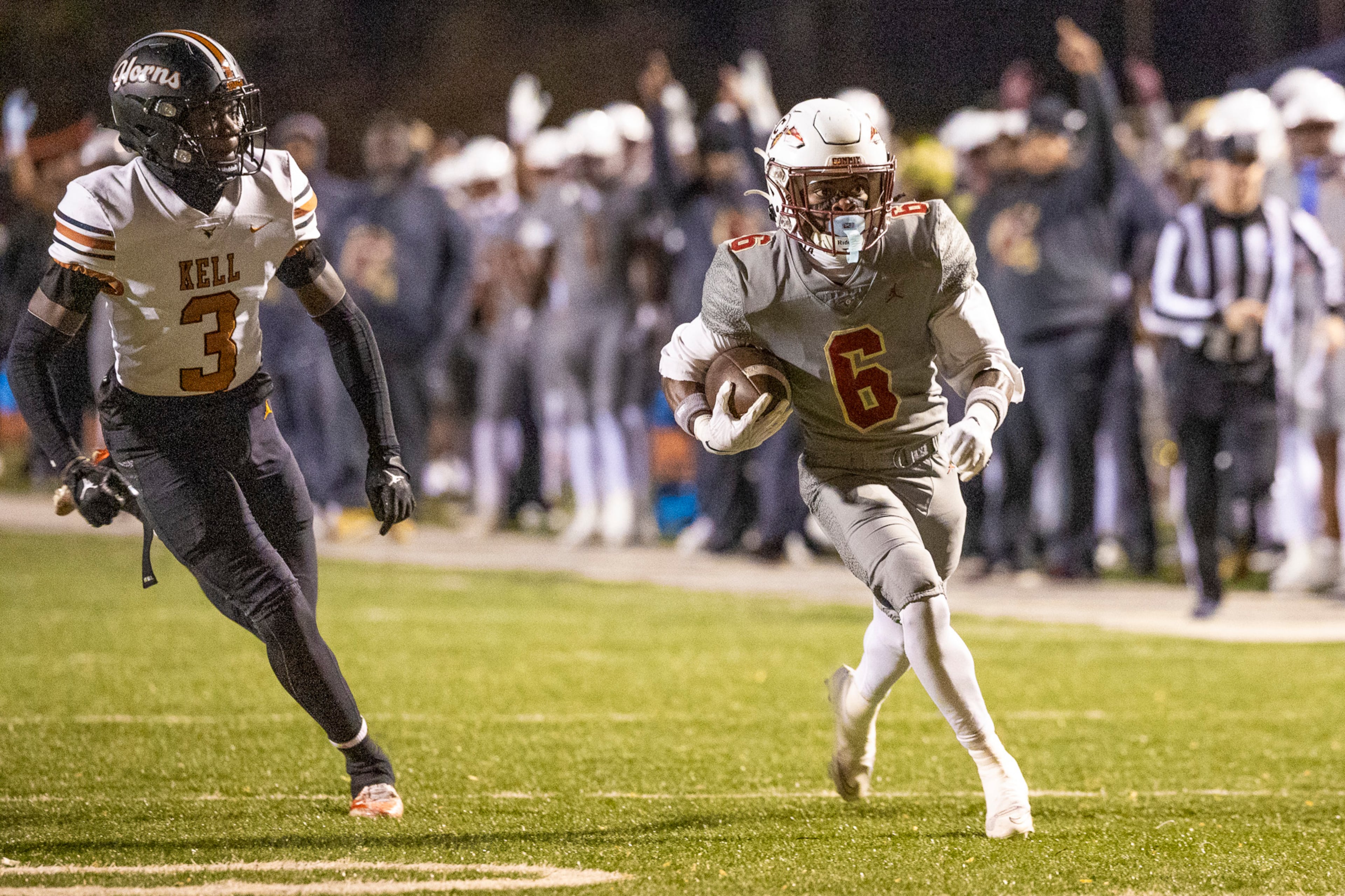 Creekside wide receiver Eric Paul Jr. (right) runs alongside Kell defensive back Tony Forney Jr. during their Class 4A semifinal game on Friday, Dec. 5, 2025, at Creekside High School in Fairburn. (Oscar Guevara Saenz for the AJC)