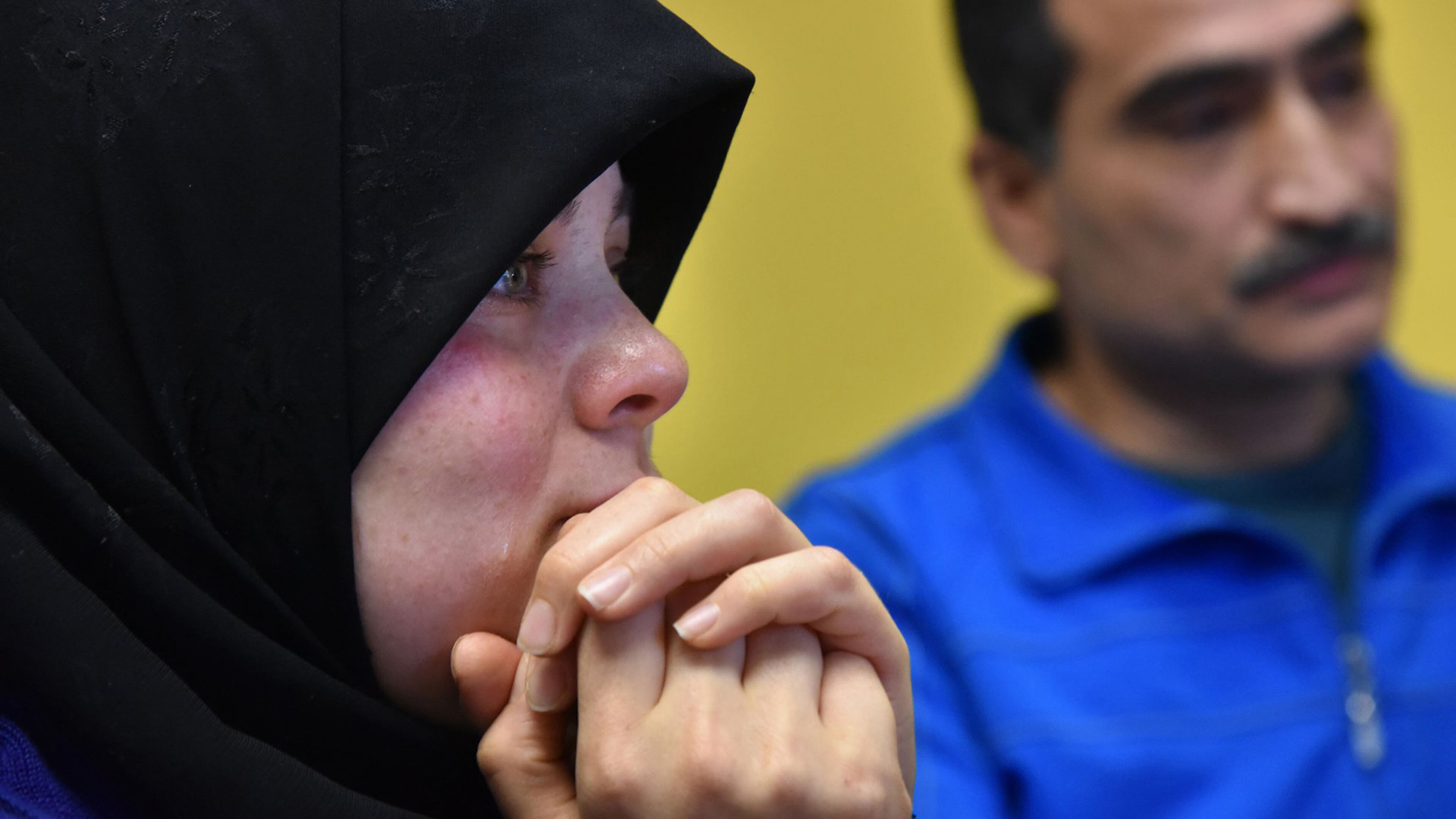 January 26, 2017 Atlanta - A tear runs down the cheek of Rouda Mohammed Ryad Sallouh as she and her husband, Mustafa Mahmoud Hammami, recall leaving Syria and coming to Atlanta. President Donald Trump has signed a pair of executive orders for building a new wall on the southwest border and for cracking down on illegal immigration he is reportedly setting his sights on restricting legal immigration. HYOSUB SHIN / HSHIN@AJC.COM