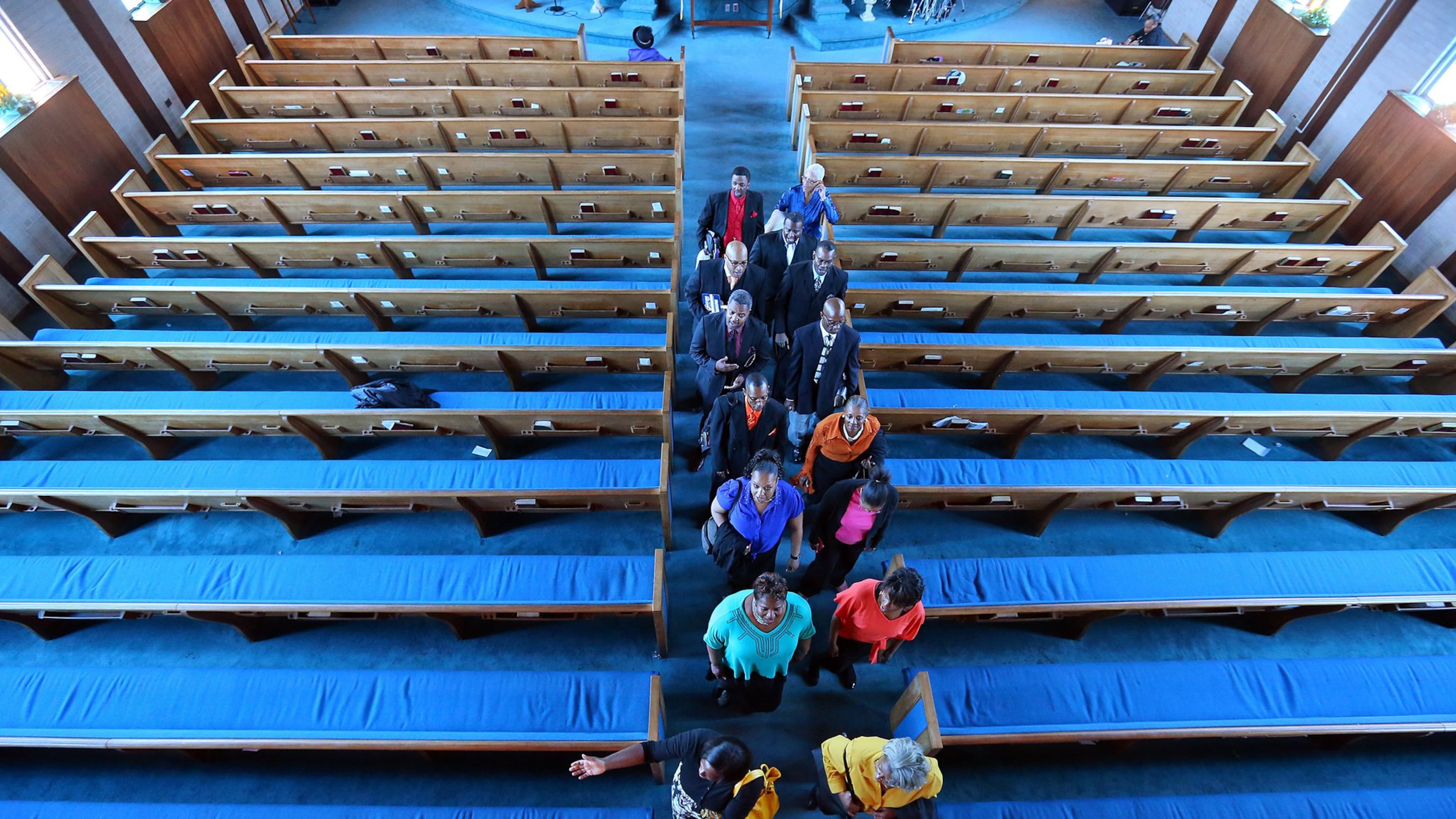 The Mount Vernon Baptist Church choir are the last in line leaving at the conclusion of their final worship service in a symbolic “Exit Ceremony” out of their sanctuary on Sunday, March 9, 2014, in Atlanta. It was the last time members will gather at the church to make room for the Falcons new stadium. The church will begin meeting at a new location next Sunday. CURTIS COMPTON / CCOMPTON@AJC.COM