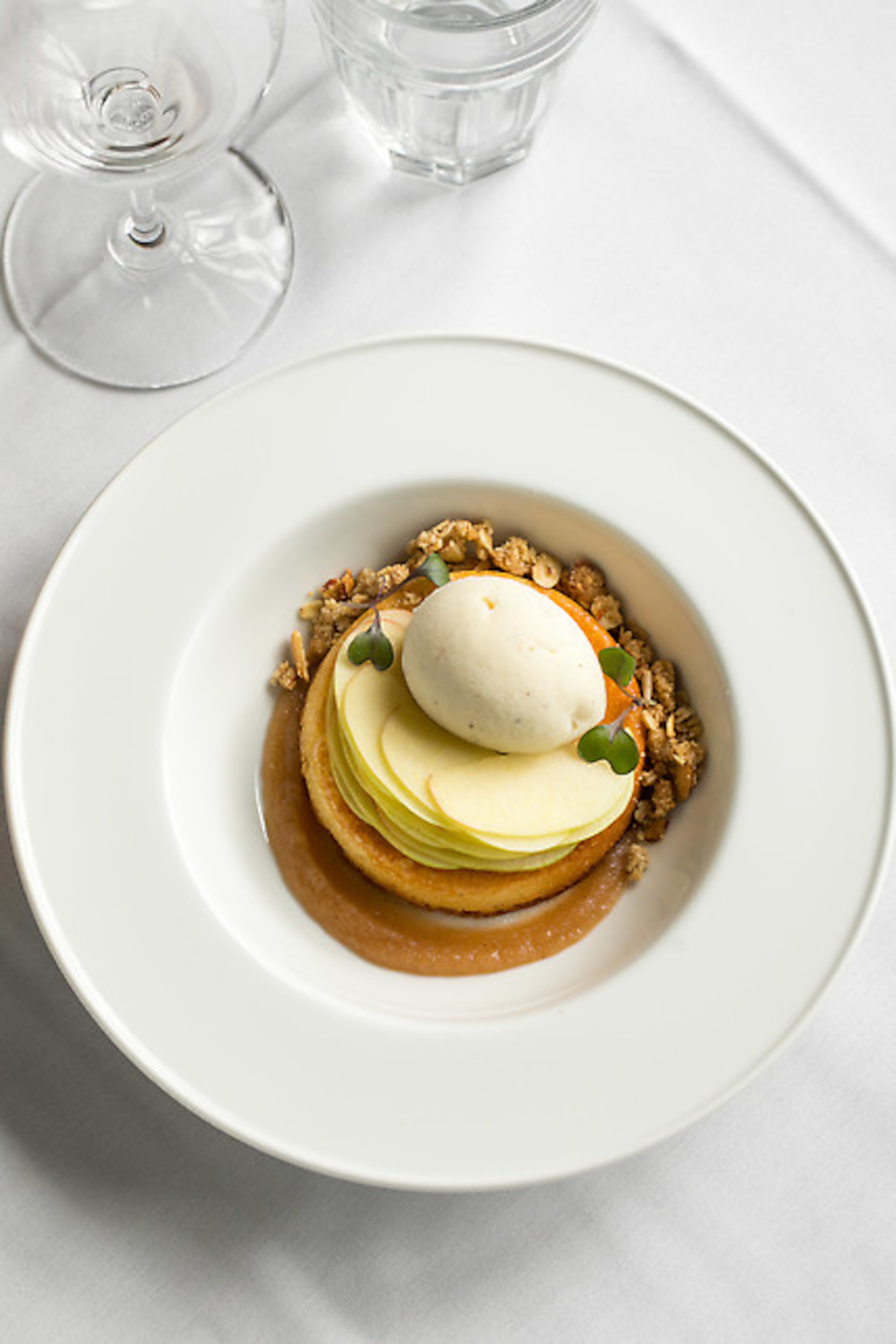Table & Main's brown butter cake is crafted from apple butter, almond streusel, fresh apples and fall spice ice cream. Photo by Shannon Sturgis of StarChefs.