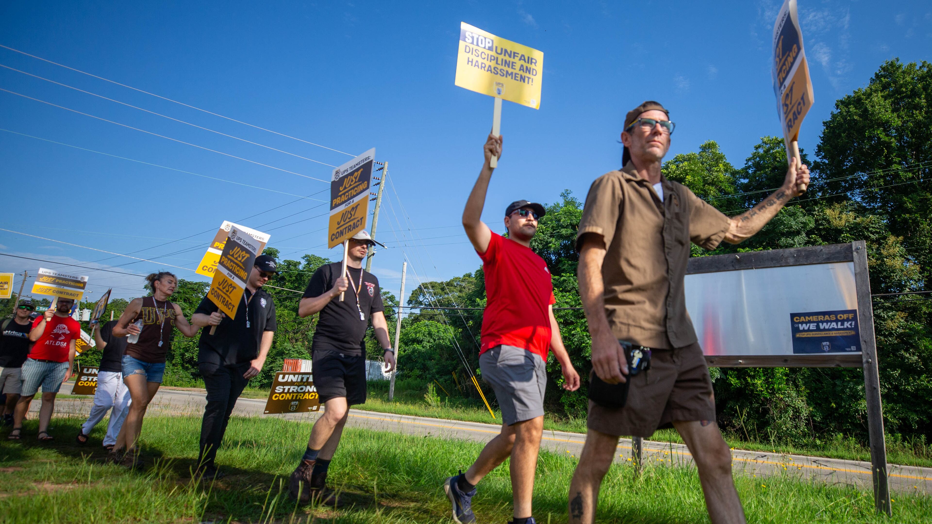 Teamster members of UPS participate in a practice picketing in Griffin on Saturday, July 8, 2023. They are preparing to go on strike August 1st if a contract agreement isn’t reached for facilities around the country. (Katelyn Myrick/katelyn.myrick@ajc.com)
