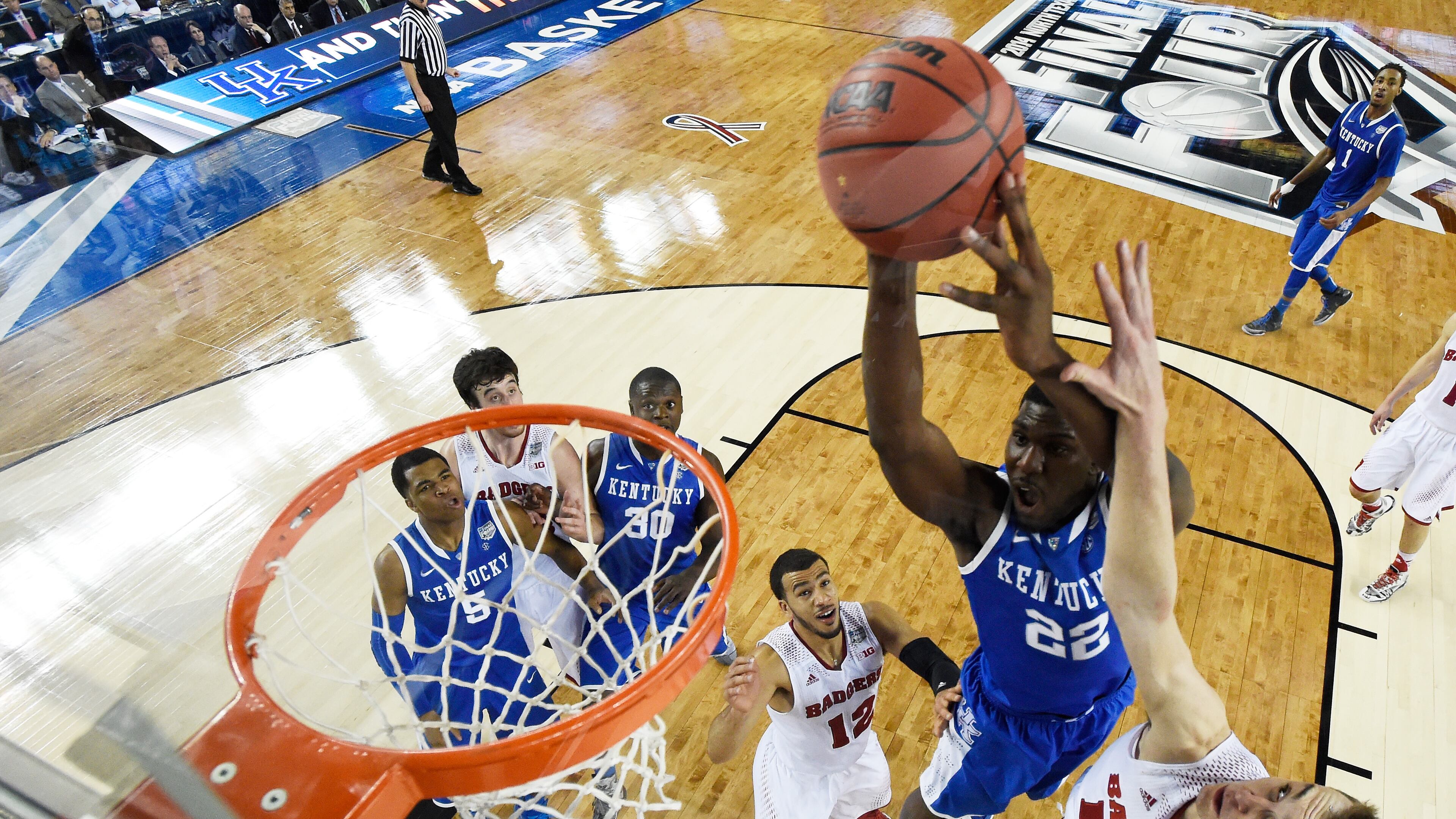 during the NCAA Men's Final Four Semifinal at AT&T Stadium on April 5, 2014 in Arlington, Texas. ARLINGTON, TX - APRIL 05: Alex Poythress #22 of the Kentucky Wildcats goes up for a shot as Sam Dekker #15 of the Wisconsin Badgers defends during the NCAA Men's Final Four Semifinal at AT&T Stadium on April 5, 2014 in Arlington, Texas. (Photo by Chris Steppig-Pool/Getty Images)