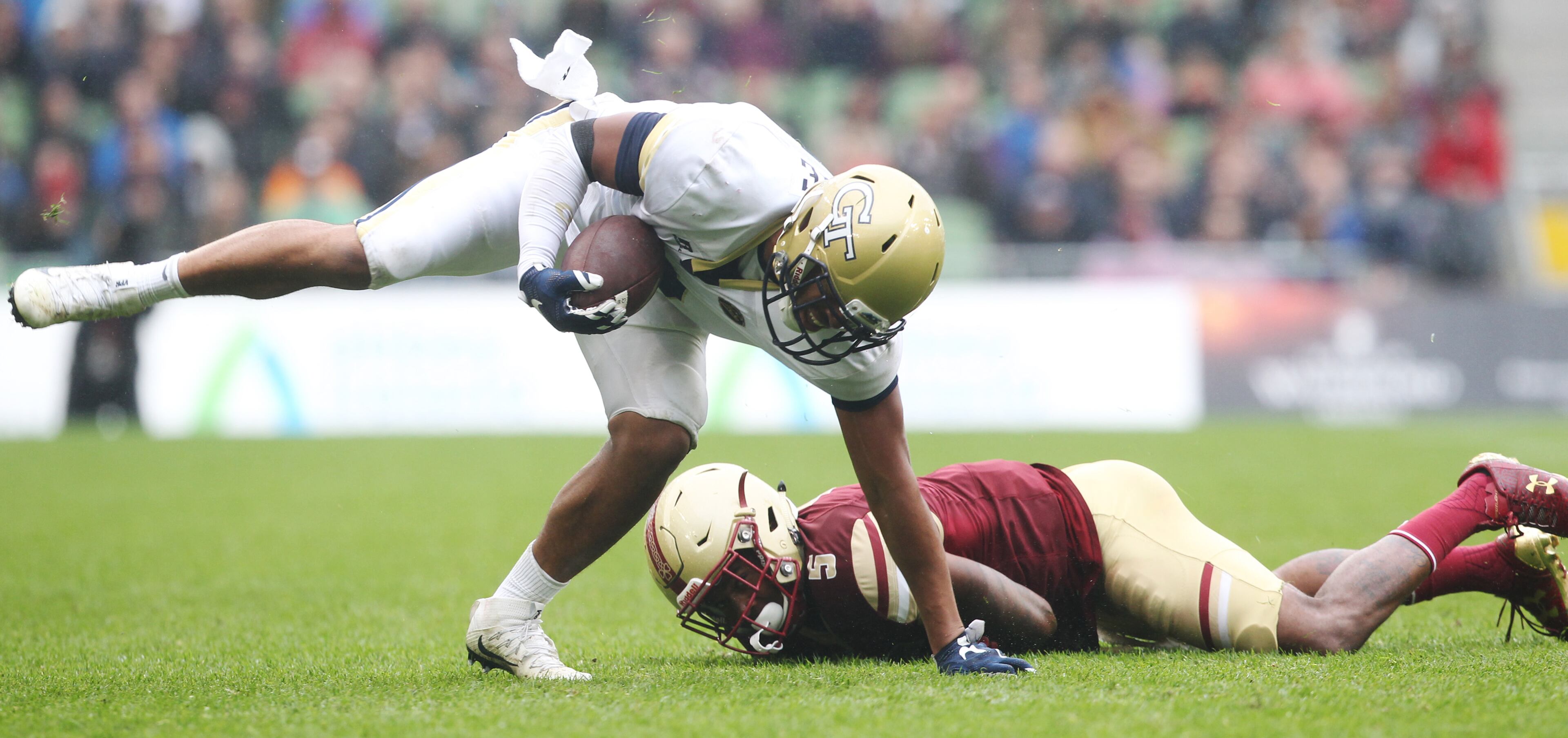 DUBLIN, IRELAND - SEPTEMBER 03: Ricky Jeune of Georgia Tech is tackled by Kamrin Moore of Boston College during the Aer Lingus College Football Classic Ireland 2016 at Aviva Stadium on September 3, 2016 in Dublin, Ireland. (Photo by Patrick Bolger/Getty Images)
