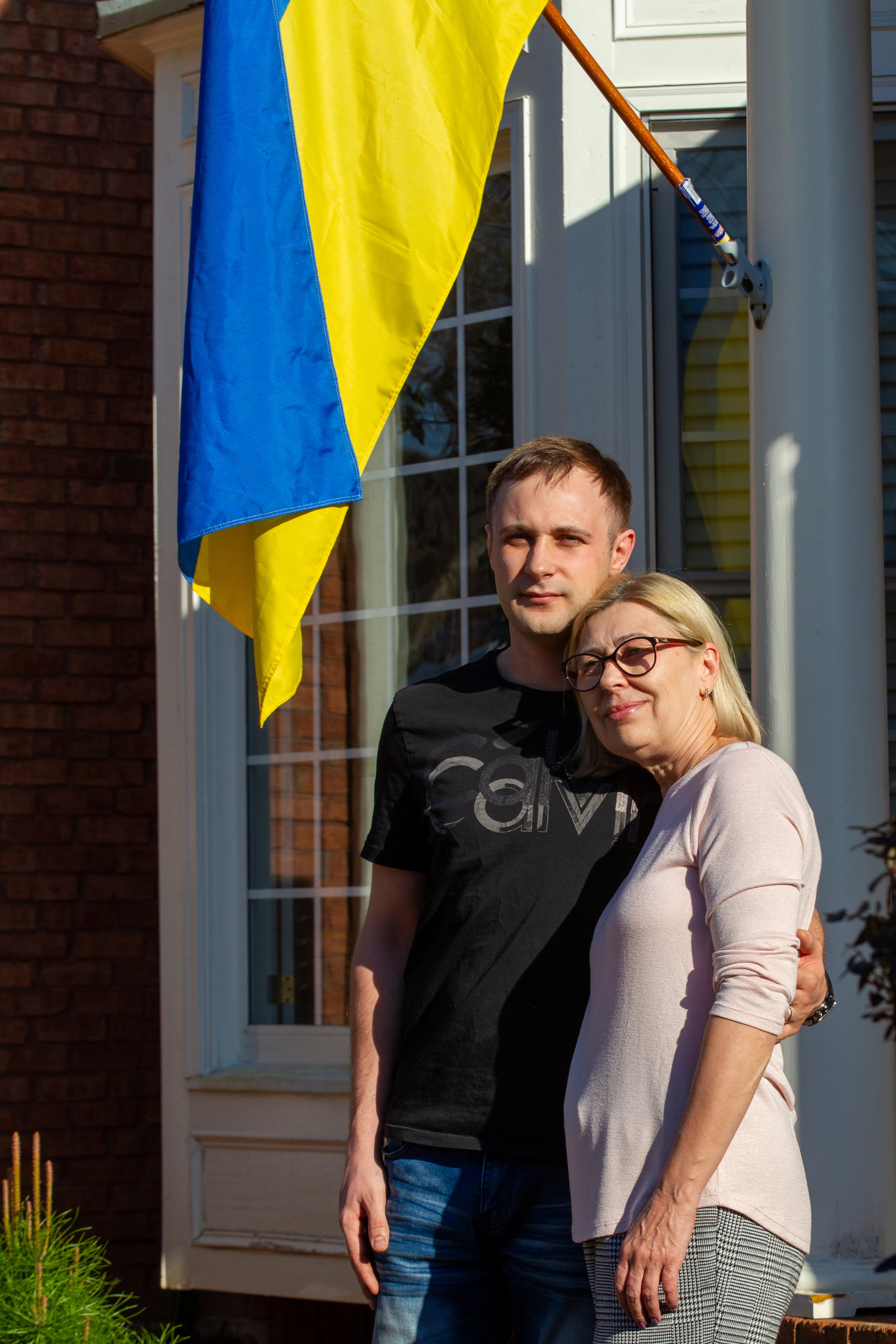 Igor Lutsenko poses for a photograph outside his Lawrenceville home with his mother, Lyudmila Soloshenko Friday, March 4, 2022. STEVE SCHAEFER FOR THE ATLANTA JOURNAL-CONSTITUTION