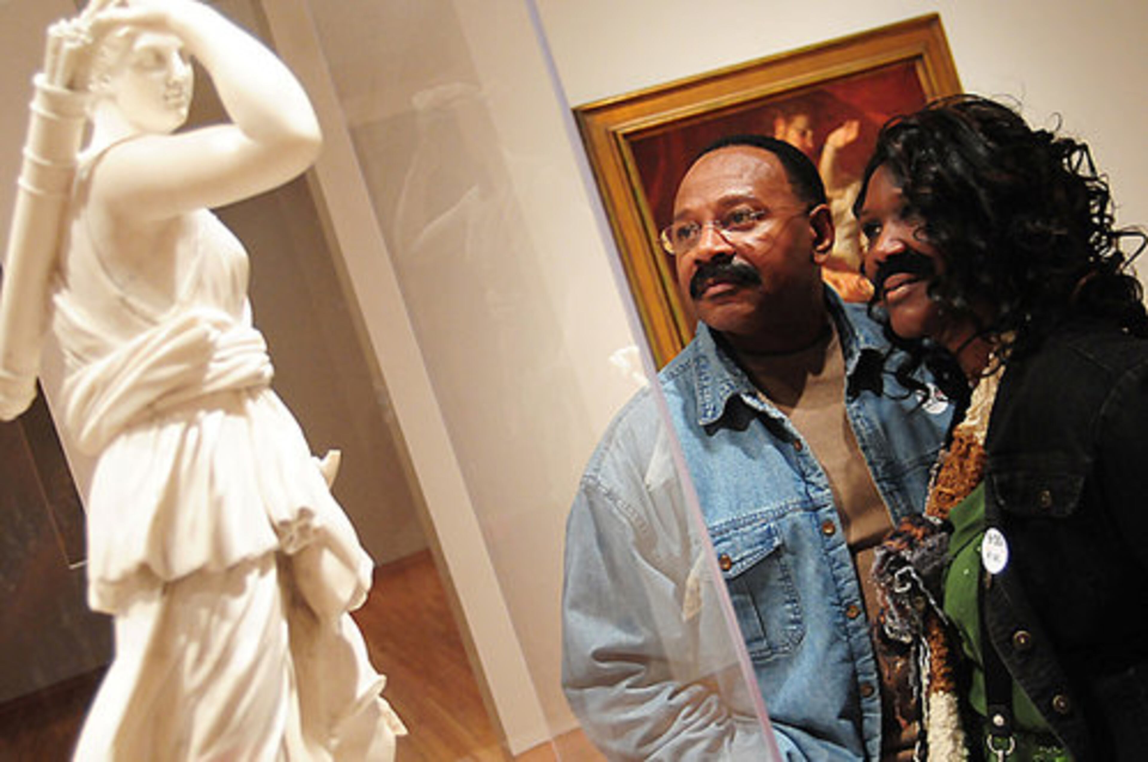 Javonne and Edward Coachman from Atlanta look at Piere Juien's "Copy after the Diana of Versailles."