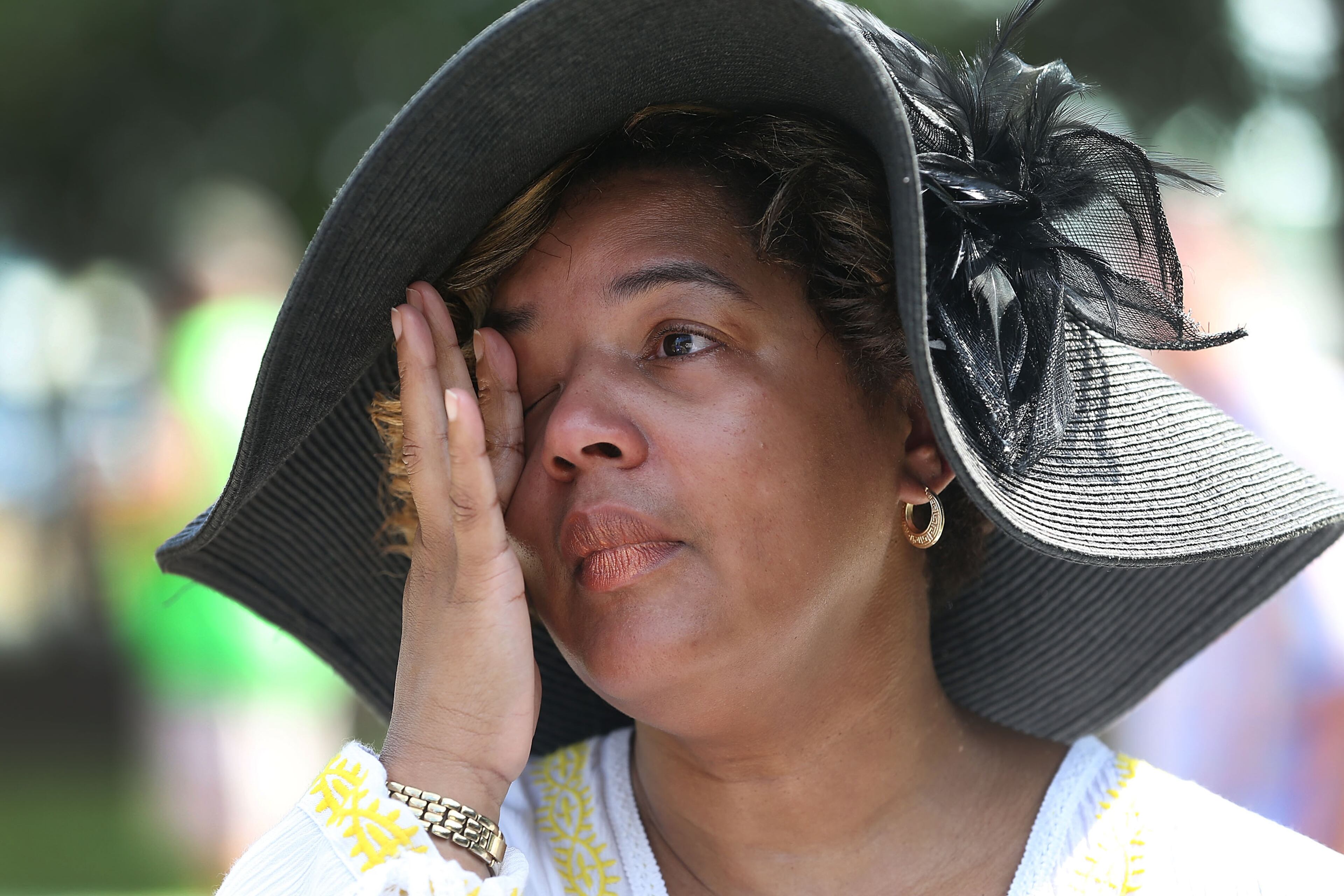 NEW ORLEANS, LA - AUGUST 29: Felicia Covin wipes her eyes as she becomes emotional while attending a 10th anniversary of Hurricane Katrina event at the New Orleans Katrina Memorial, where nearly 100 unclaimed or unidentified victims of Hurricane Katrina are interred on August 29, 2015 in New Orleans, Louisiana. Hurricane Katrina killed 1836 people and is considered the costliest natural disaster in U.S. history. (Photo by Joe Raedle/Getty Images)