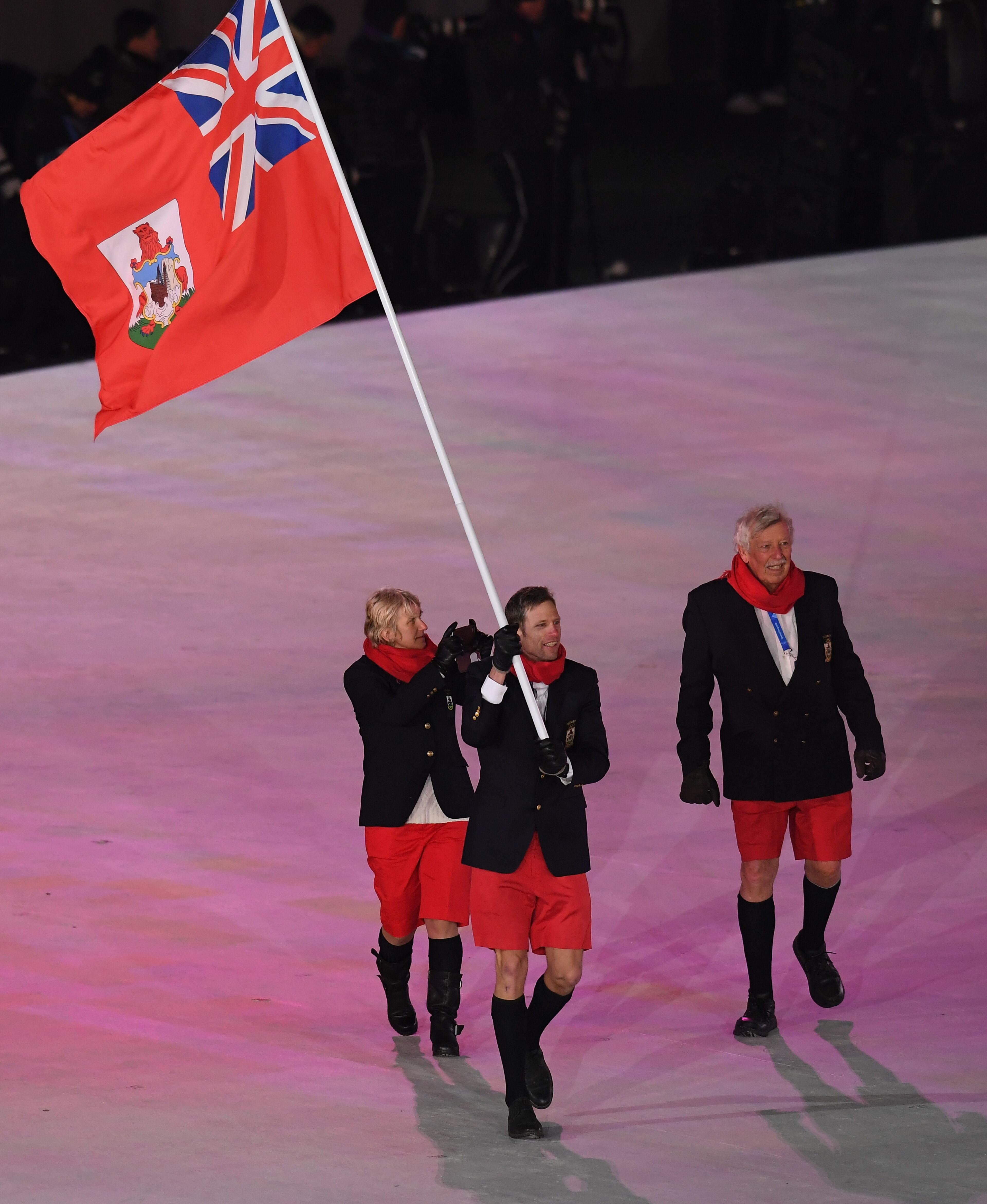 PYEONGCHANG-GUN, SOUTH KOREA - FEBRUARY 09: Flag bearer Tucker Murphy of Bermuda leads the team during the Opening Ceremony of the PyeongChang 2018 Winter Olympic Games at PyeongChang Olympic Stadium on February 9, 2018 in Pyeongchang-gun, South Korea. (Photo by Harry How/Getty Images)