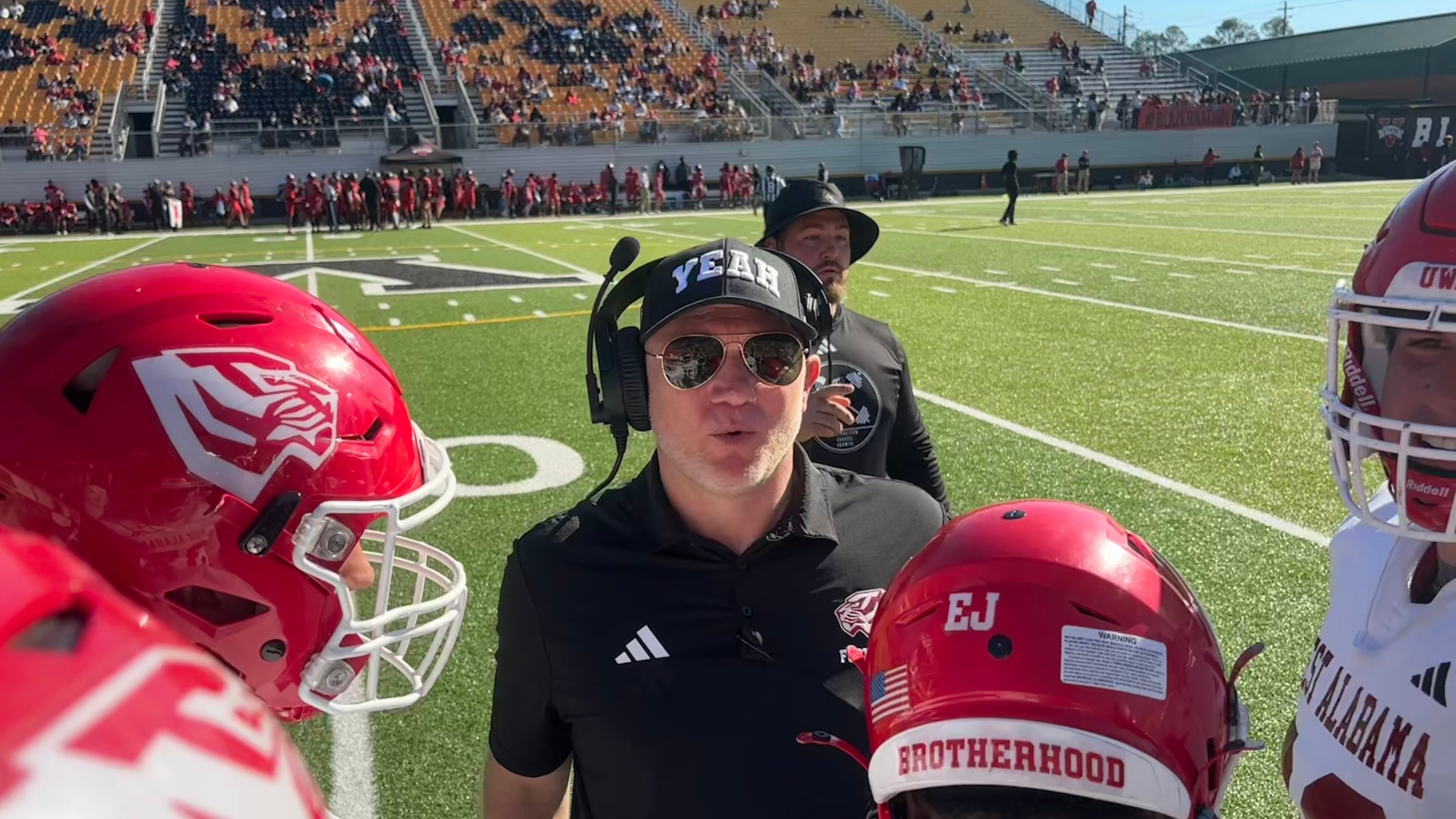 Scott Cochran (center), nicknamed "Coach Yeah," recently finished in his first season coaching West Alabama after drug addiction halted his SEC coaching career. (Jack Leo/AJC)