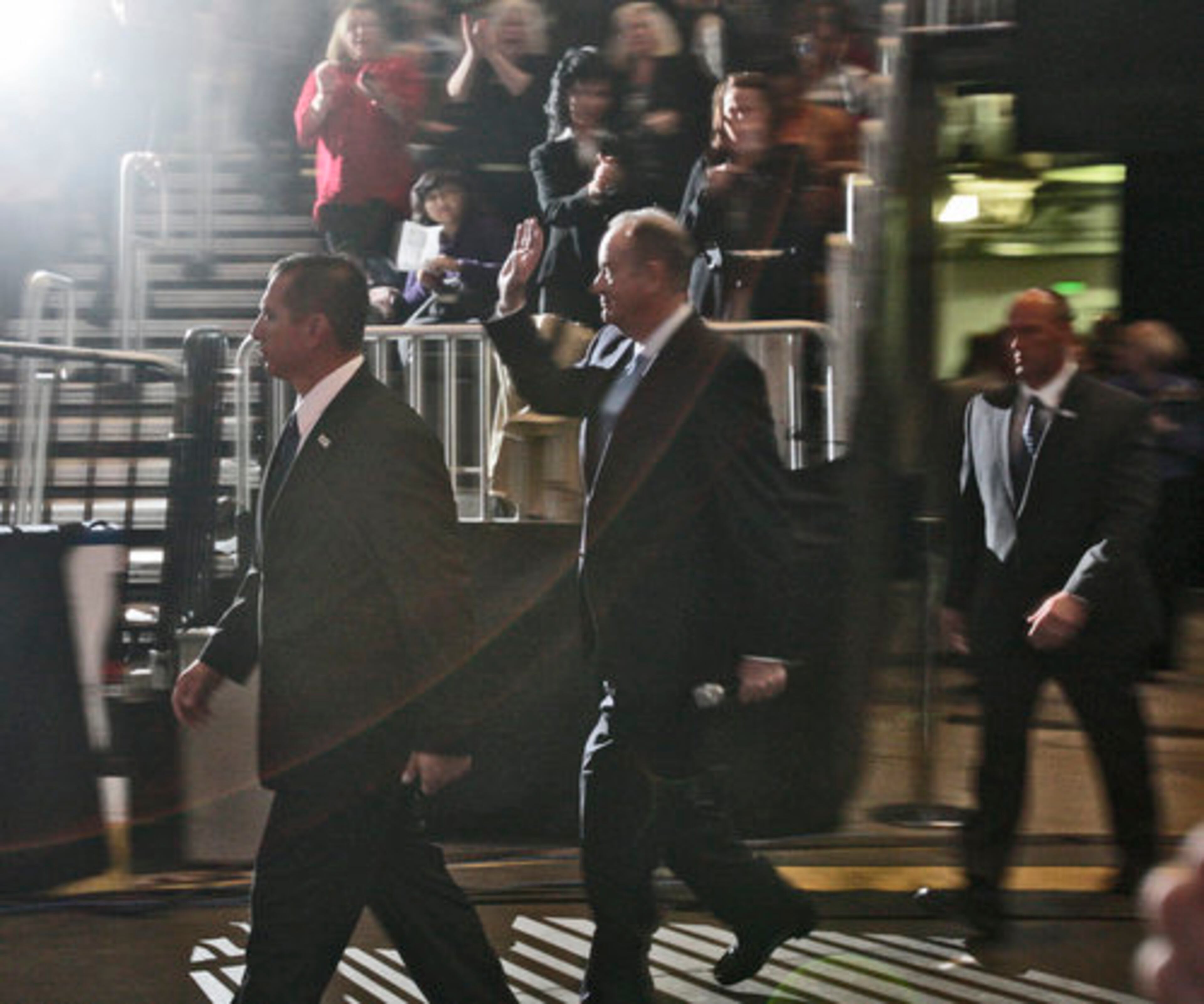 Bill O'Reilly waves to the cheering crowd as he enters the arena.