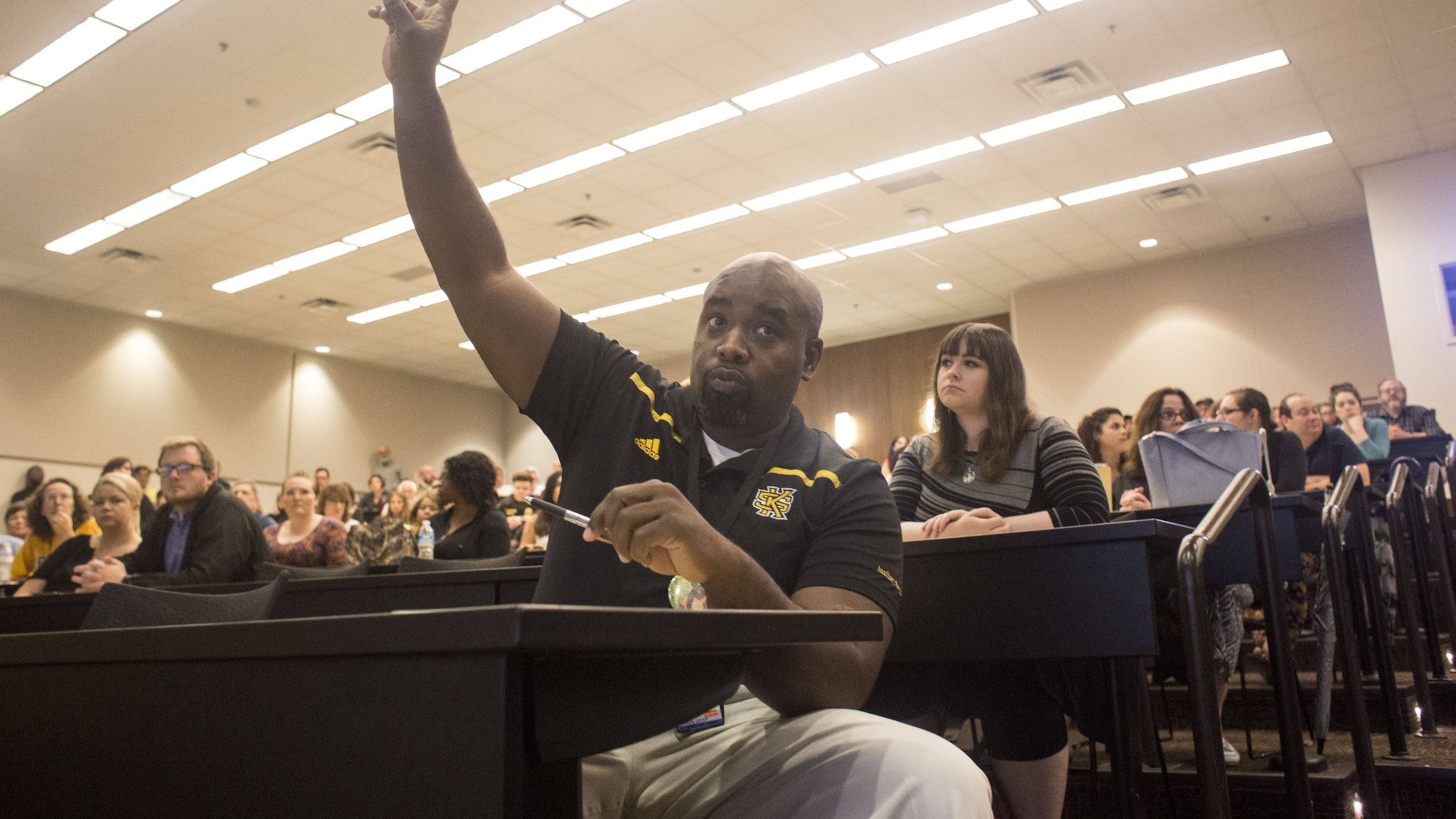Omari Hodge, a staff member at Kennesaw State University who works in the health clinic, asks a question about House Bill 280, the “campus-carry” bill, on June 22, 2017. Chad Rhym/ Chad.Rhym@ajc.com