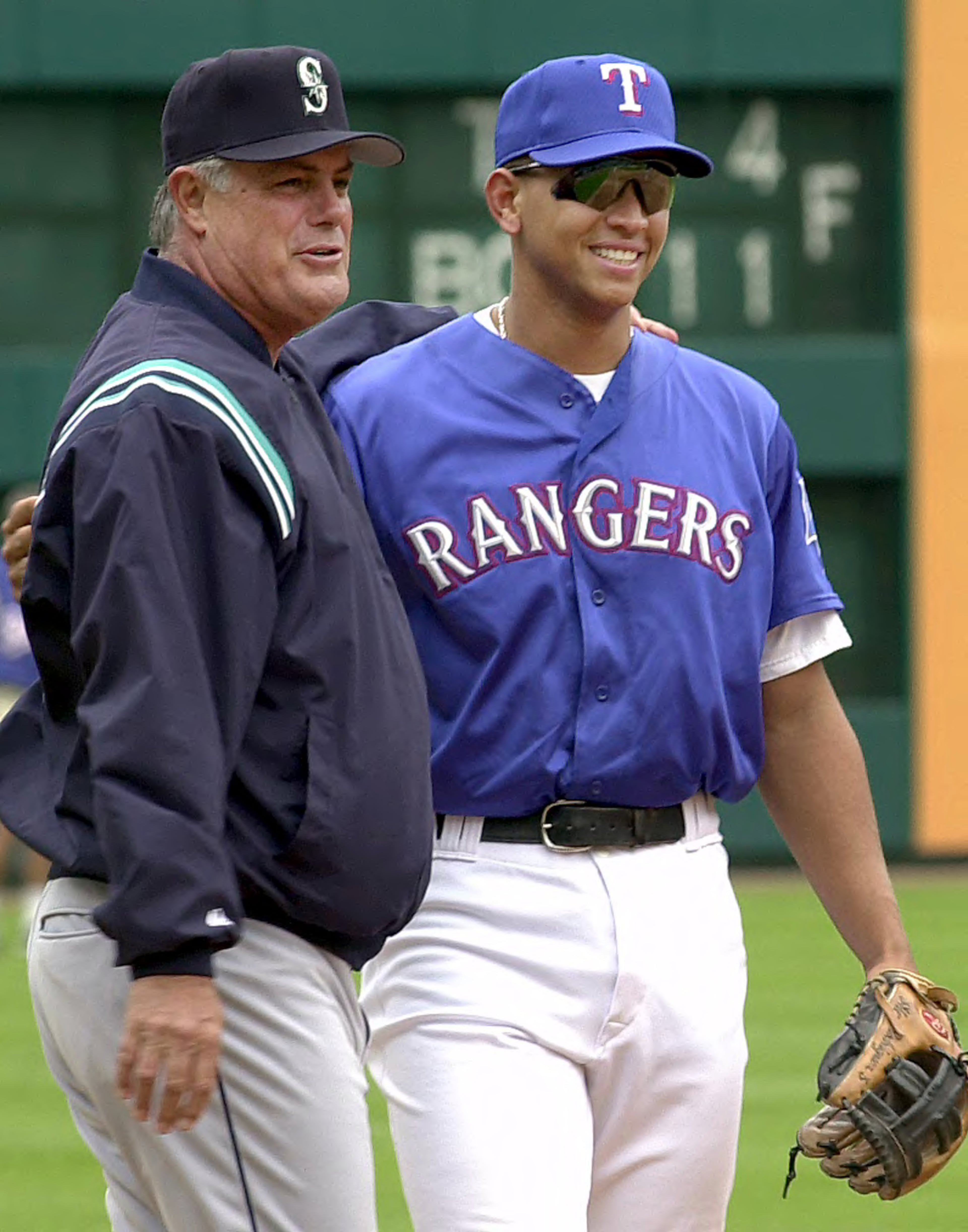 2001: Seattle Mariners manager Lou Piniella, left, embraces a former Mariners player, Texas Rangers' Alex Rodriguez, as they watch batting practice Friday, April 6, 2001, in Arlington, Texas. Before the Texas Rangers gave Rodriguez the richest contract in sports history, the Mariners provided the shortstop his major league foundation. Rodriguez made his major league debut for Seattle in 1994, when he was 18. Two years later, he was the everyday shortstop and made his first All-Star game appearance. (AP Photo/LM Otero)