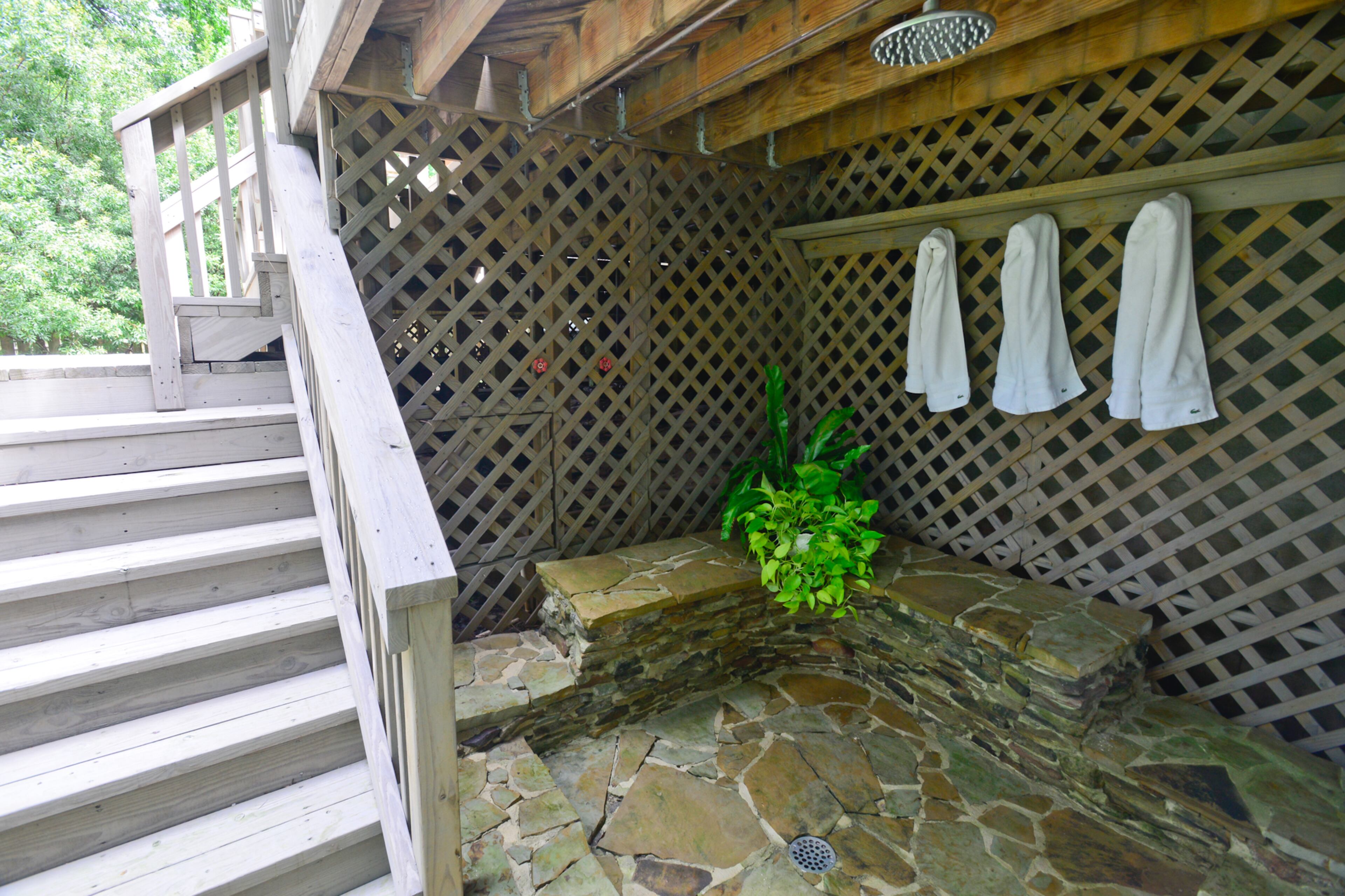 The outdoor shower is a quirky feature that the couple wasn't sure they would ever use but have discovered its benefits after yard work and outdoor activities.