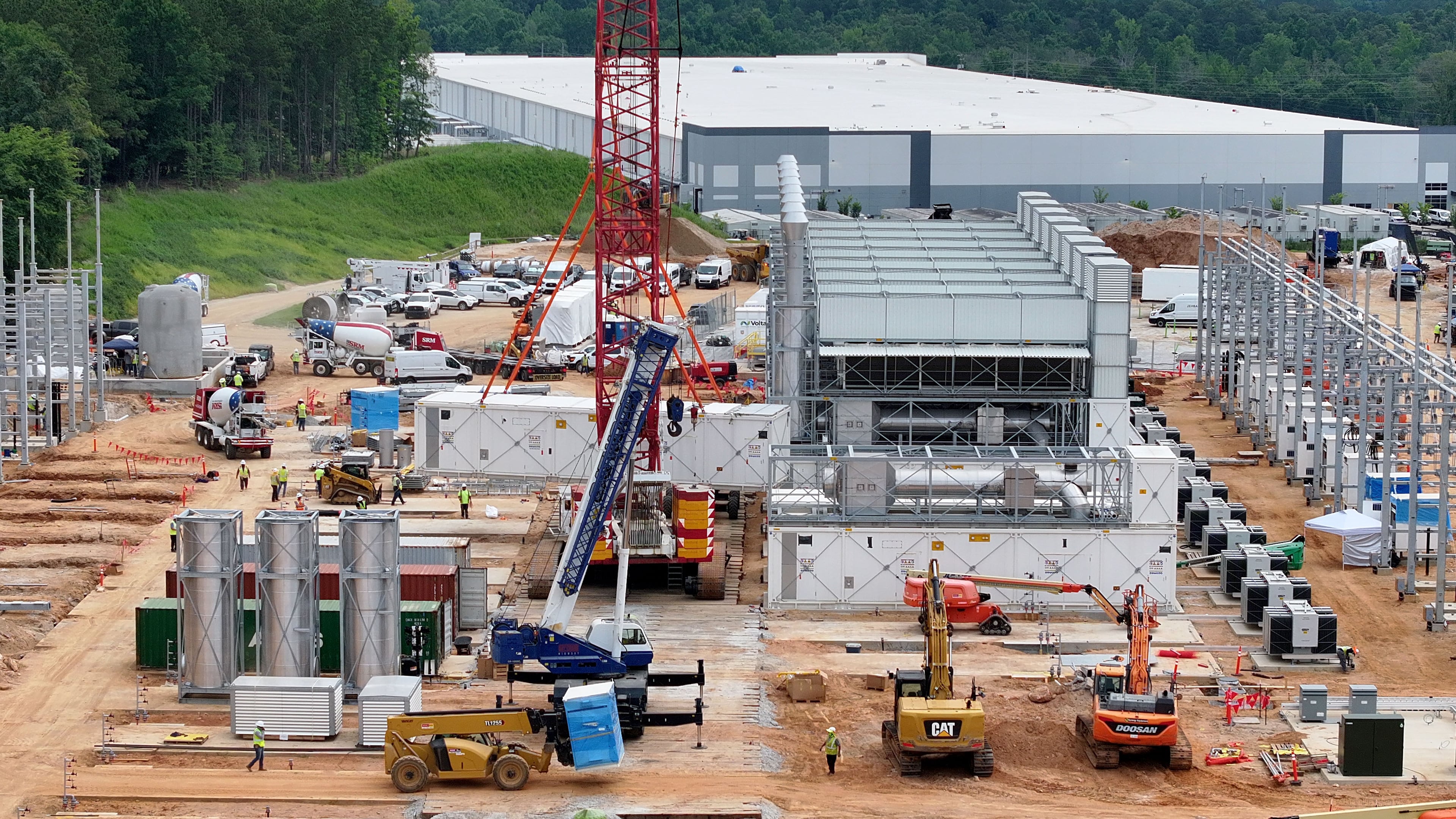 Aerial view of off-grid generators being installed, with the data center in the background, on Thursday, June 25, 2026, in Covington. A data center plans to get its primary power supply from a set of off-grid generators, the first setup of its kind in Georgia. (Hyosub Shin/AJC)