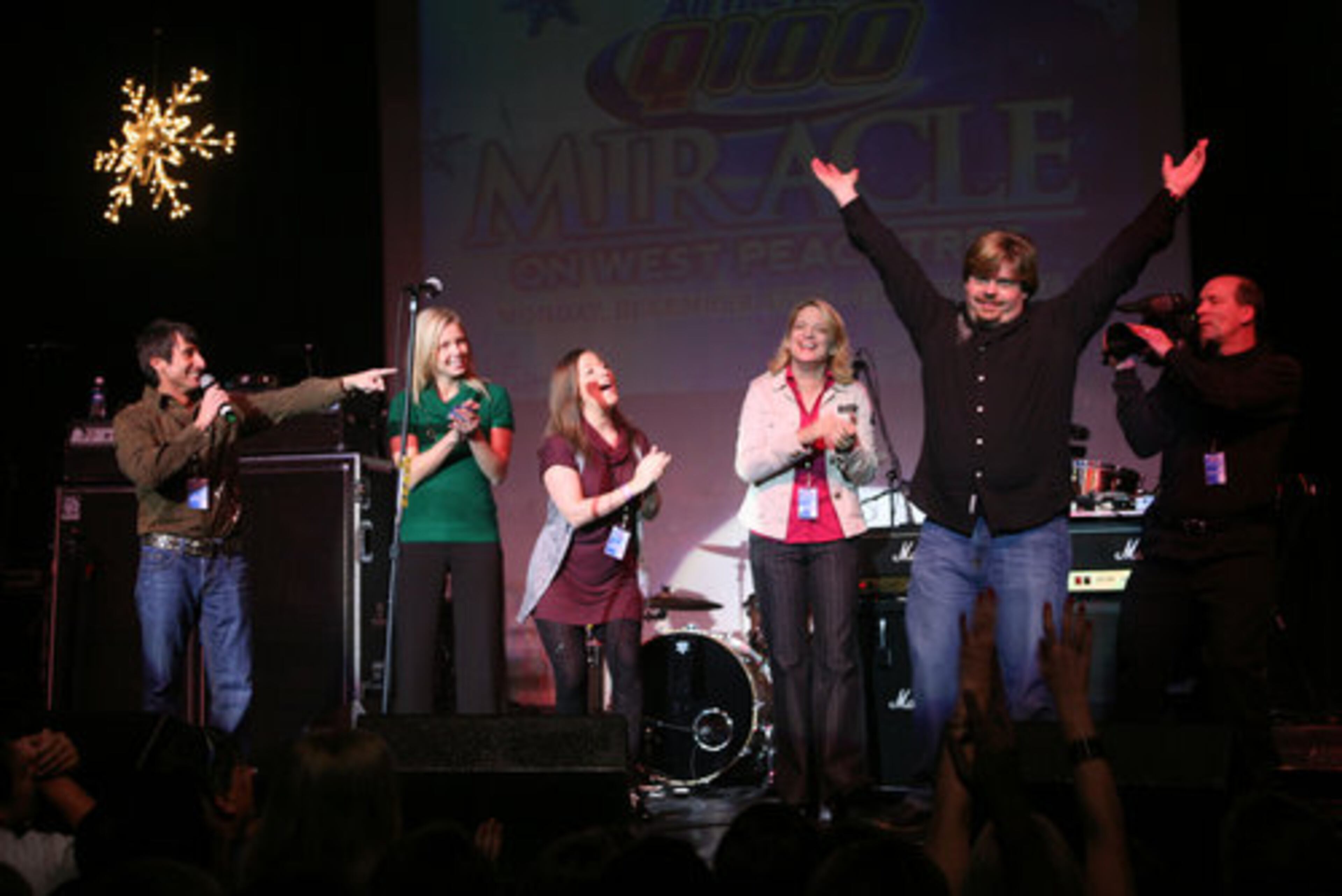 Bert, Jenn, Wendy, Melissa, and Jeff from Q100 greet the crowd.