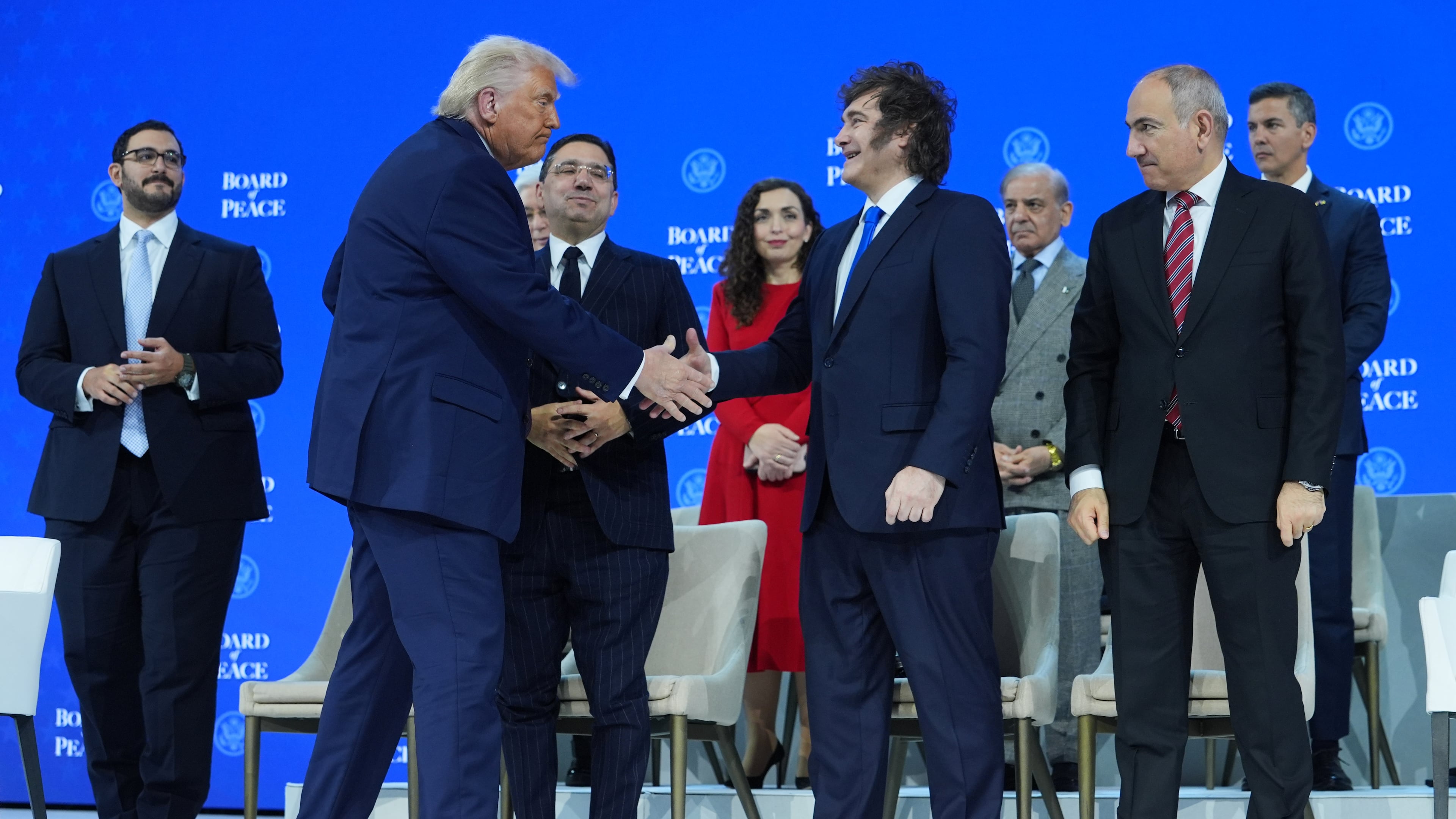 FILE - President Donald Trump, center left, shakes hands with Javier Milei, President of Argentina, during the Annual Meeting of the World Economic Forum in Davos, Switzerland, Thursday, Jan. 22, 2026. (AP Photo/Evan Vucci,File)