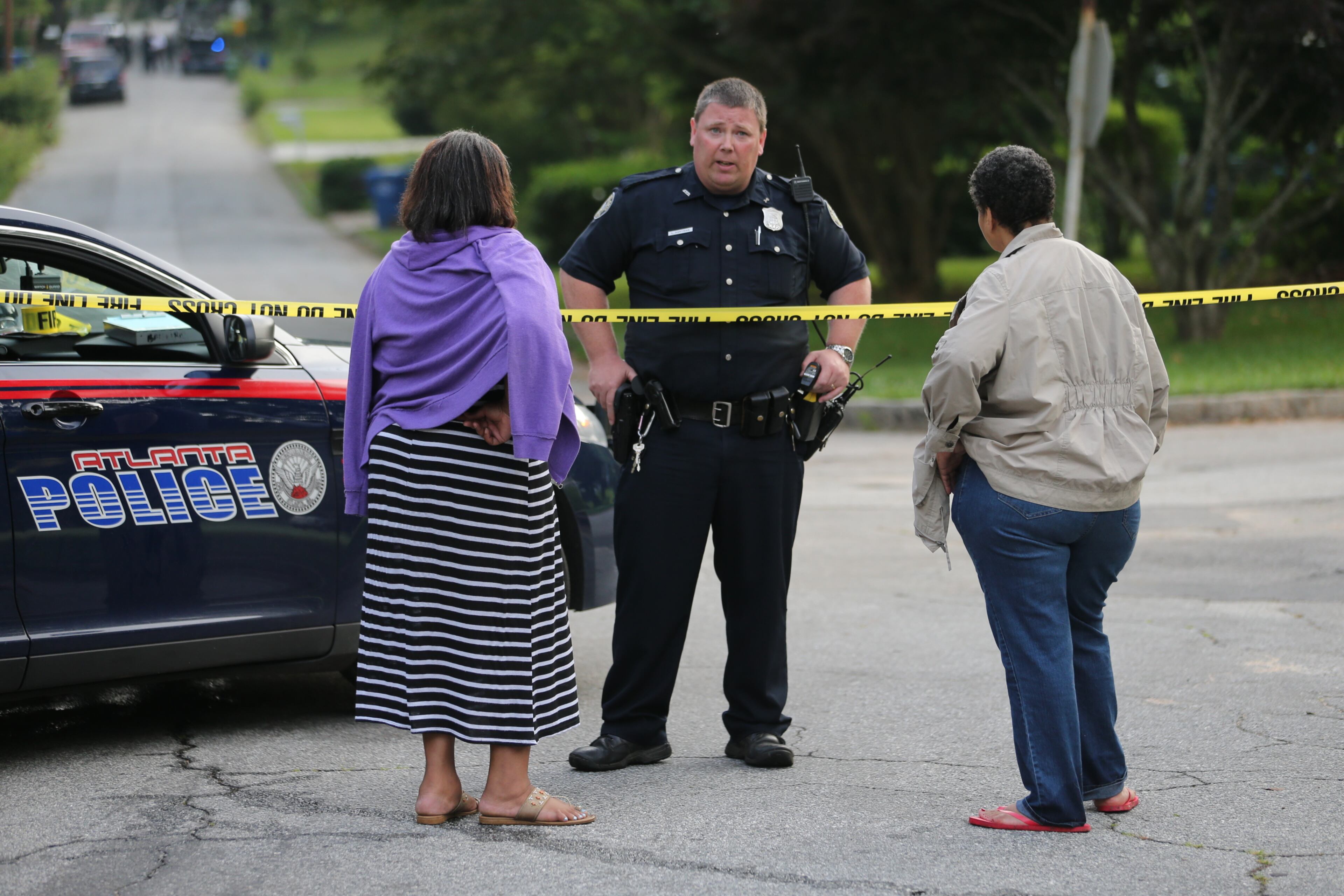 Atlanta police surrounded a home in southwest Atlanta for several hours early today, but when SWAT officers went into the house, the person whey were looking for was not there. JOHN SPINK/JOHNSPINK@AJC.COM