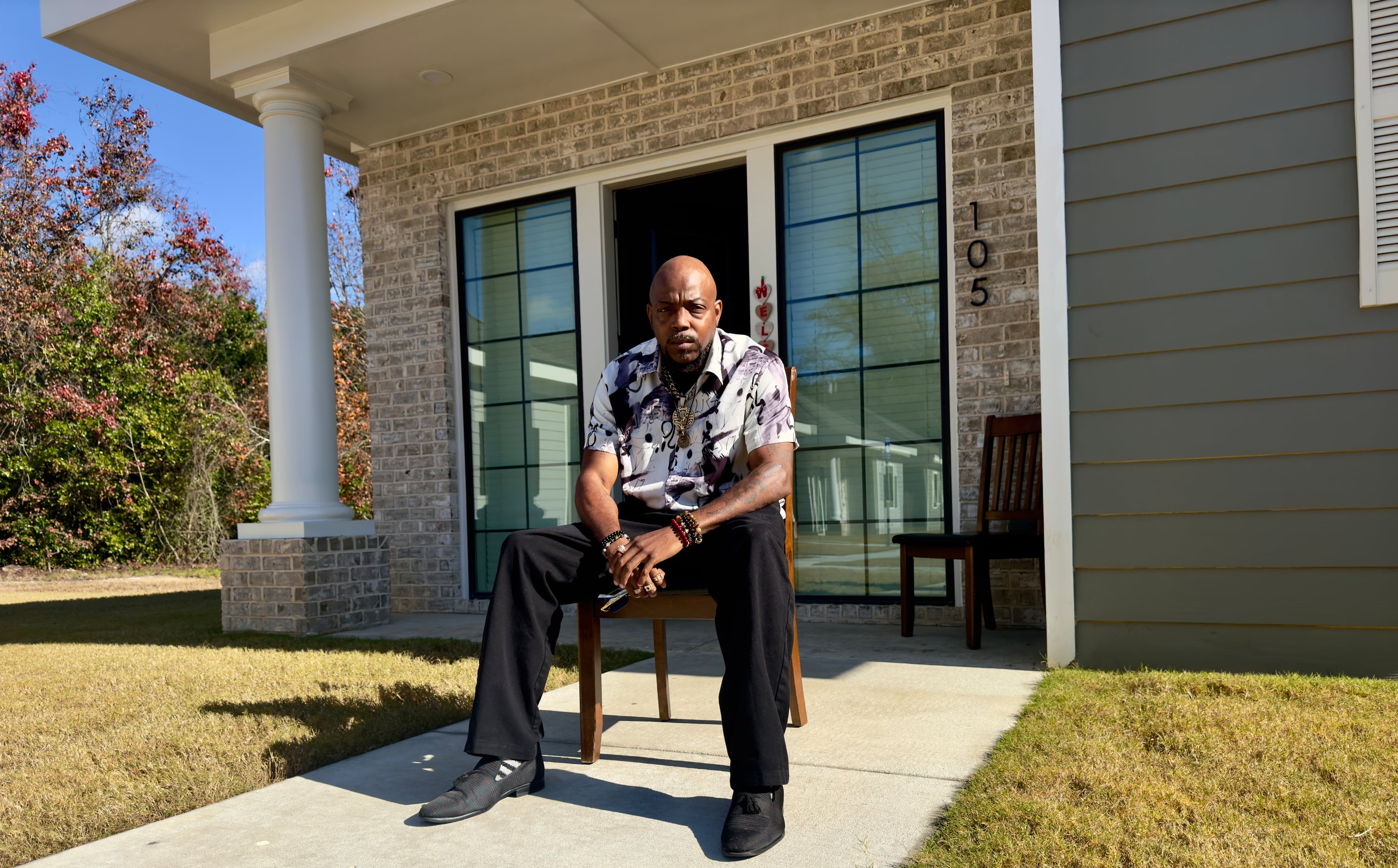 Jeremiah Canty sits outside his residence at one of the "tiny cottages" in Macon that were recently built for people who have been homeless and have a mental health or substance-use disorder. (Joe Kovac Jr./AJC)
