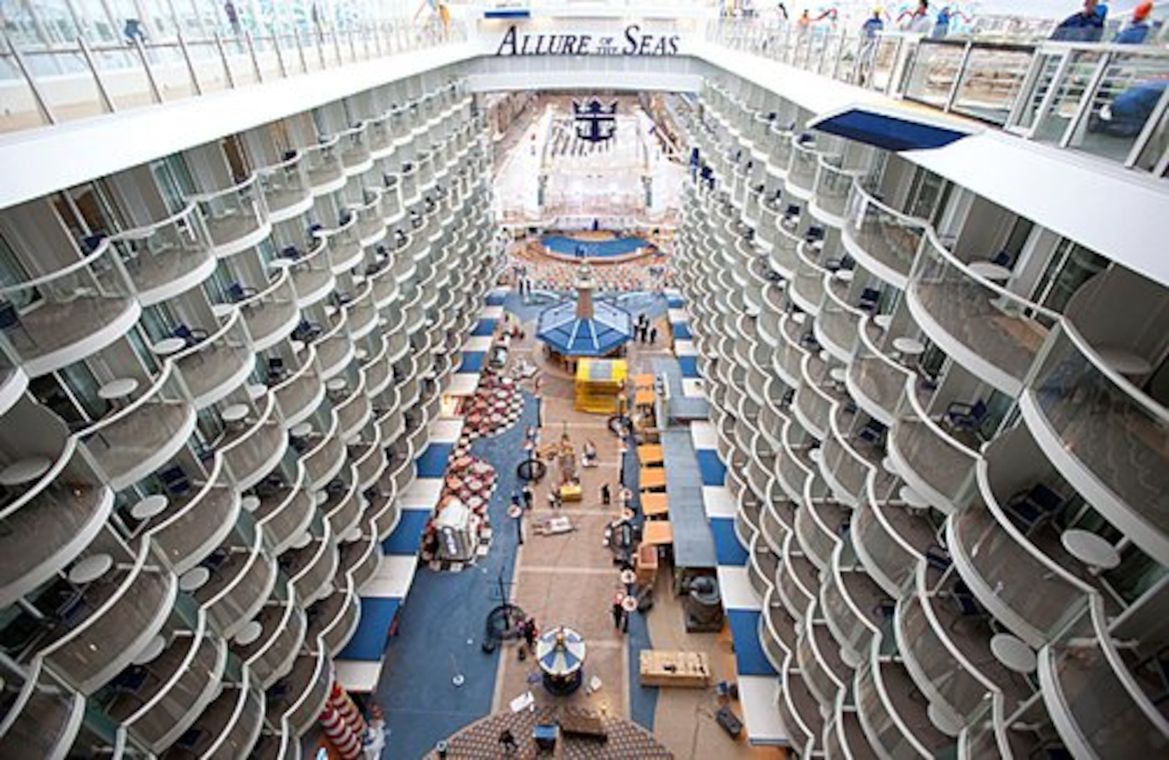 The outdoor shopping mall and guest suites are seen on board Royal Caribbean Cruises Ltd.'s Allure of the Seas cruise ship at the Turku shipyard in Turku, Finland, on Thursday, Oct. 28, 2010.