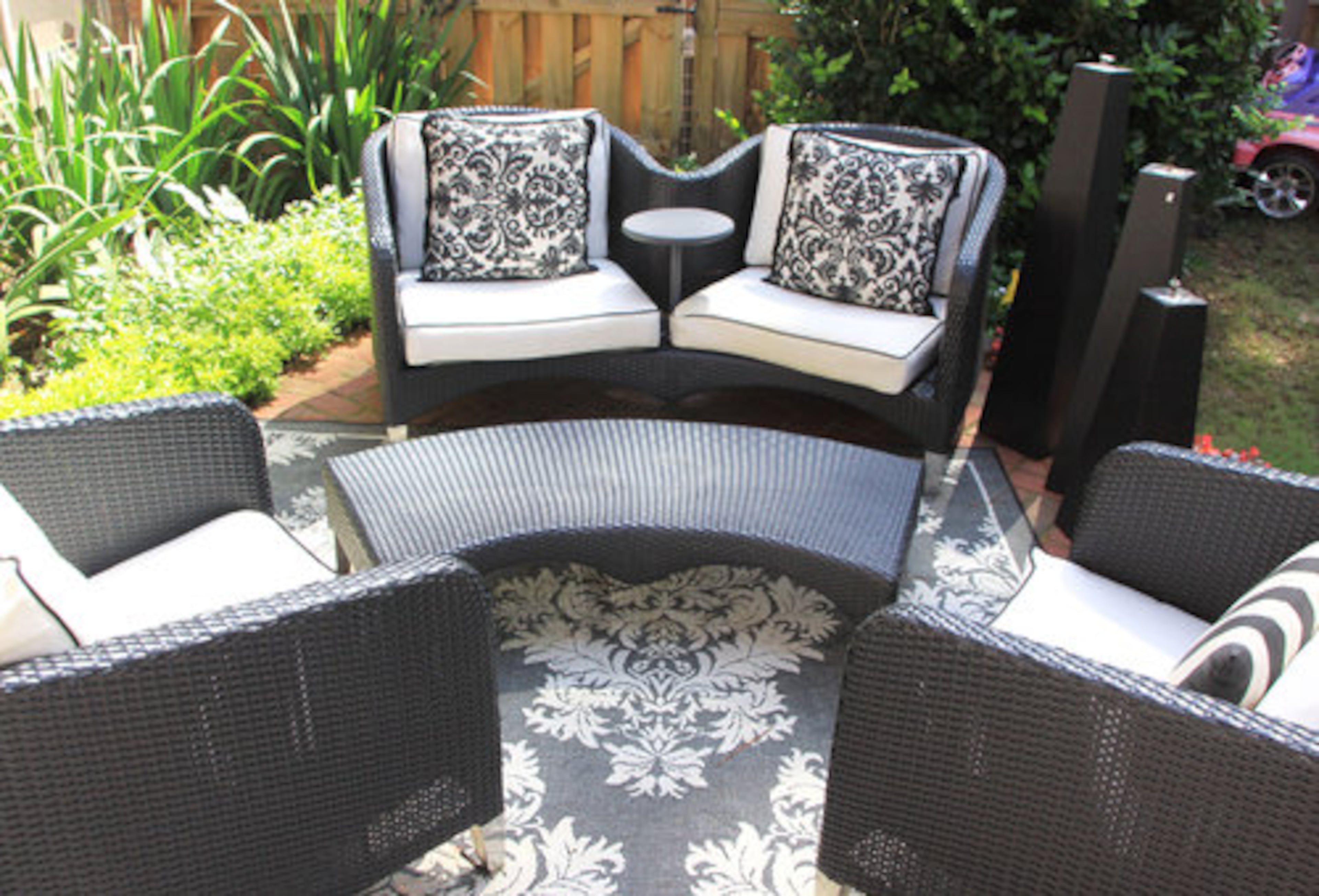 "I just had my whole garden landscaped. Thanks Big Poppa 'cause I have no idea what's out there. He had them come over here and handle it. It looks fantastic." There's also a pond with waterfall and tiered floral arrangement.