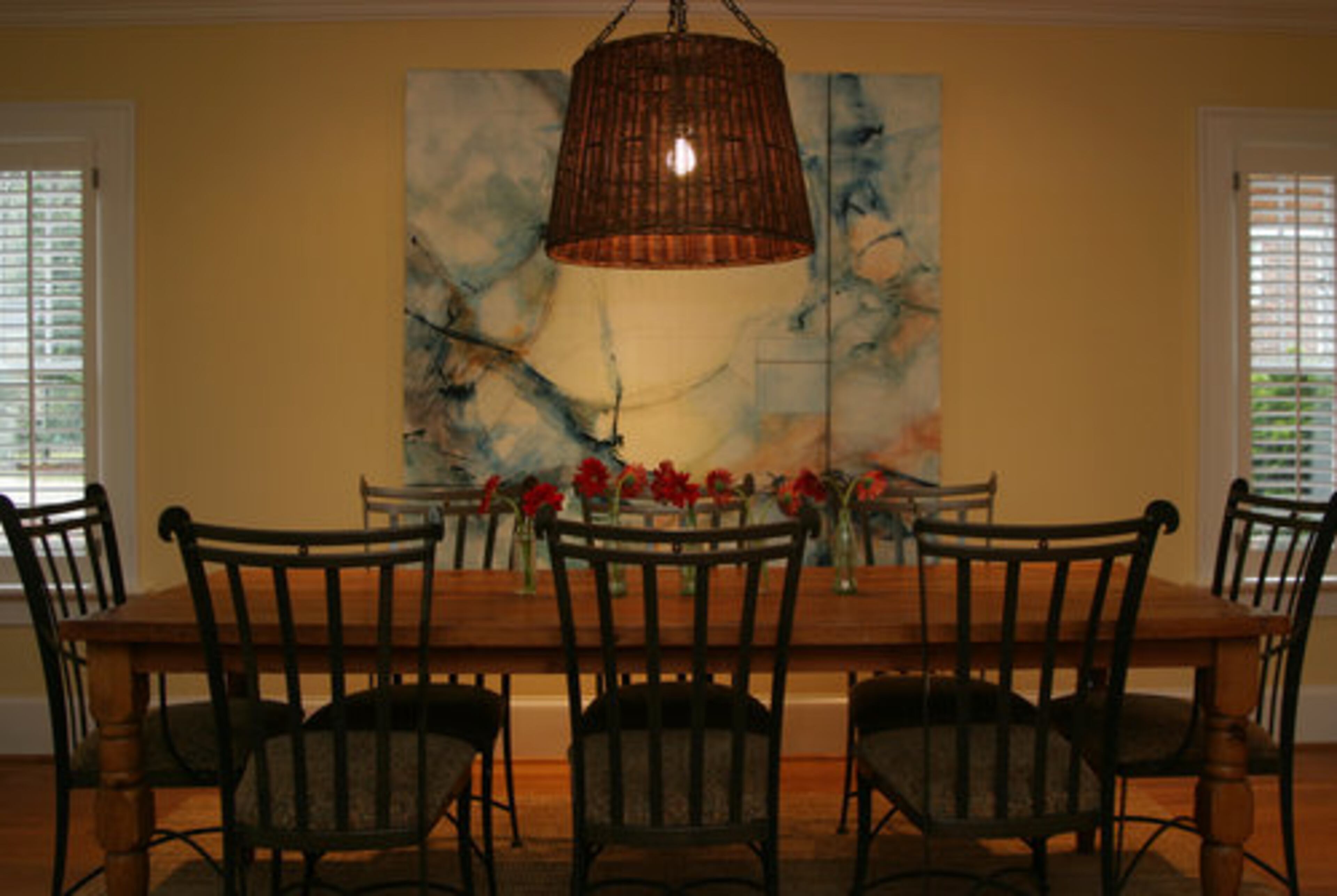 The farm table adds charm to the casual dining area.