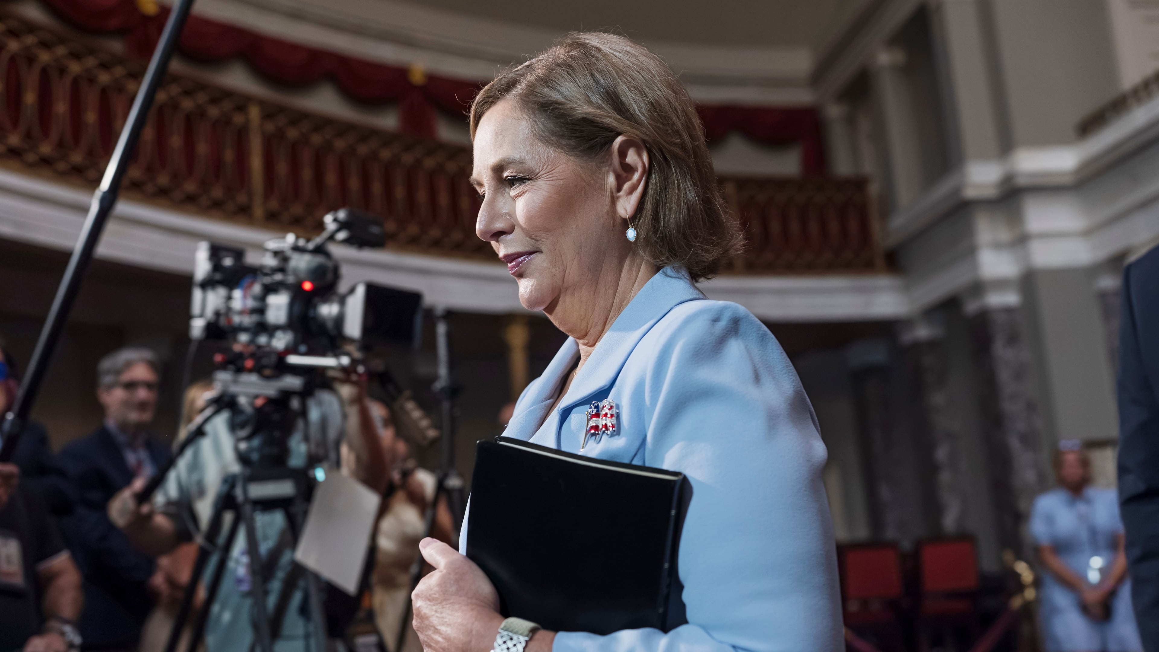 Newly-sworn Sen. Darline Graham, R-S.C., sister of Lindsey Graham, walks past cameras as she leaves the Old Senate Chamber following a cermonial oath of office ceremony allowing her to serve as her late brother's temporary replacement, at the Capitol in Washington, Tuesday, July 14, 2026, (AP Photo/J. Scott Applewhite)