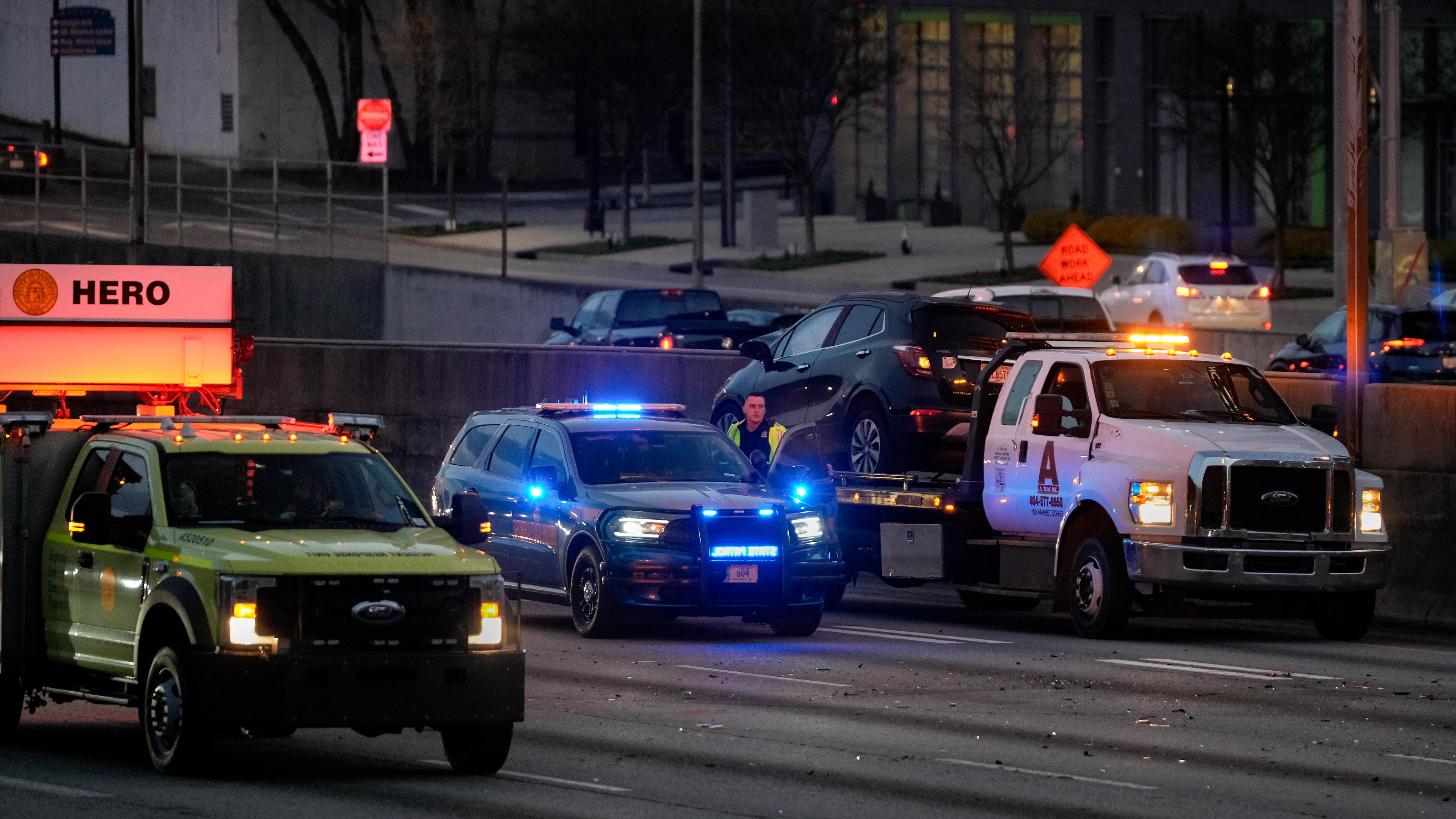 A GDOT HERO unit blocks traffic on the connector after an accident shut down the interstate on Friday, March 7, 2025. (Ben Hendren for the AJC)