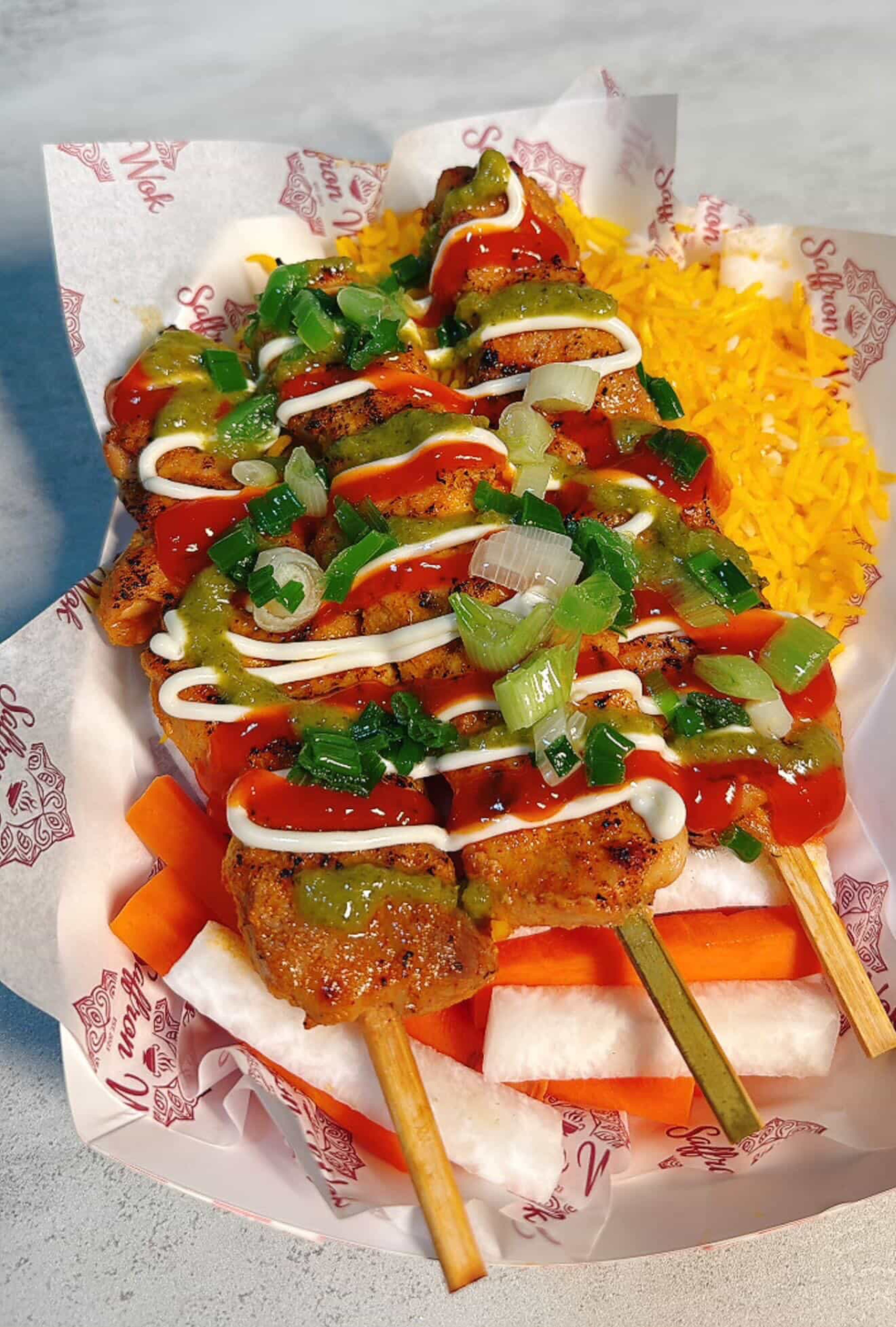 Saffron Wok’s pho-risian chicken skewers. (Courtesy of Saffron Wok)