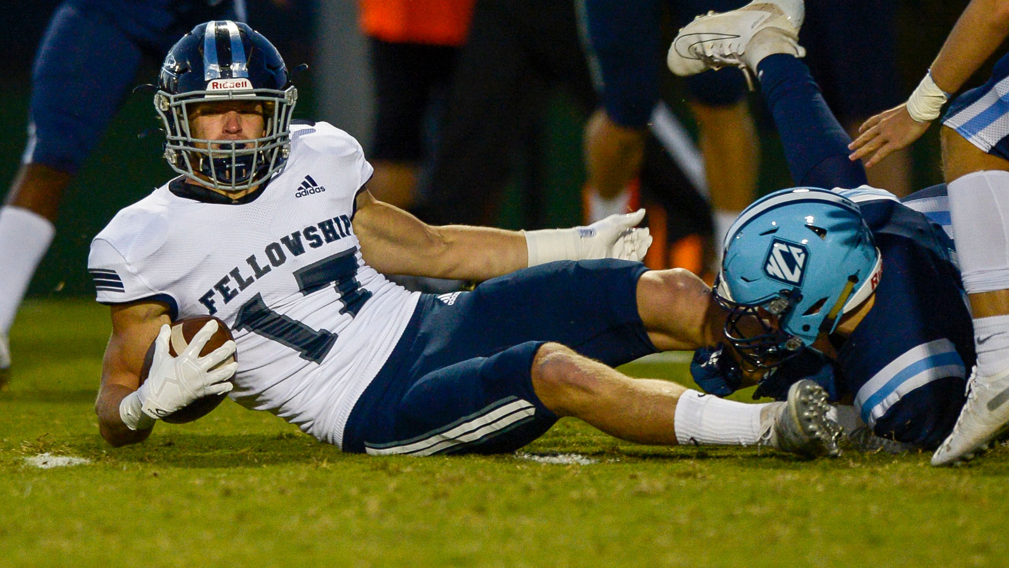 Fellowship Christian running back Murphy Reeves (17) is tackled during a running play in the first half of his game at North Cobb Christian Friday