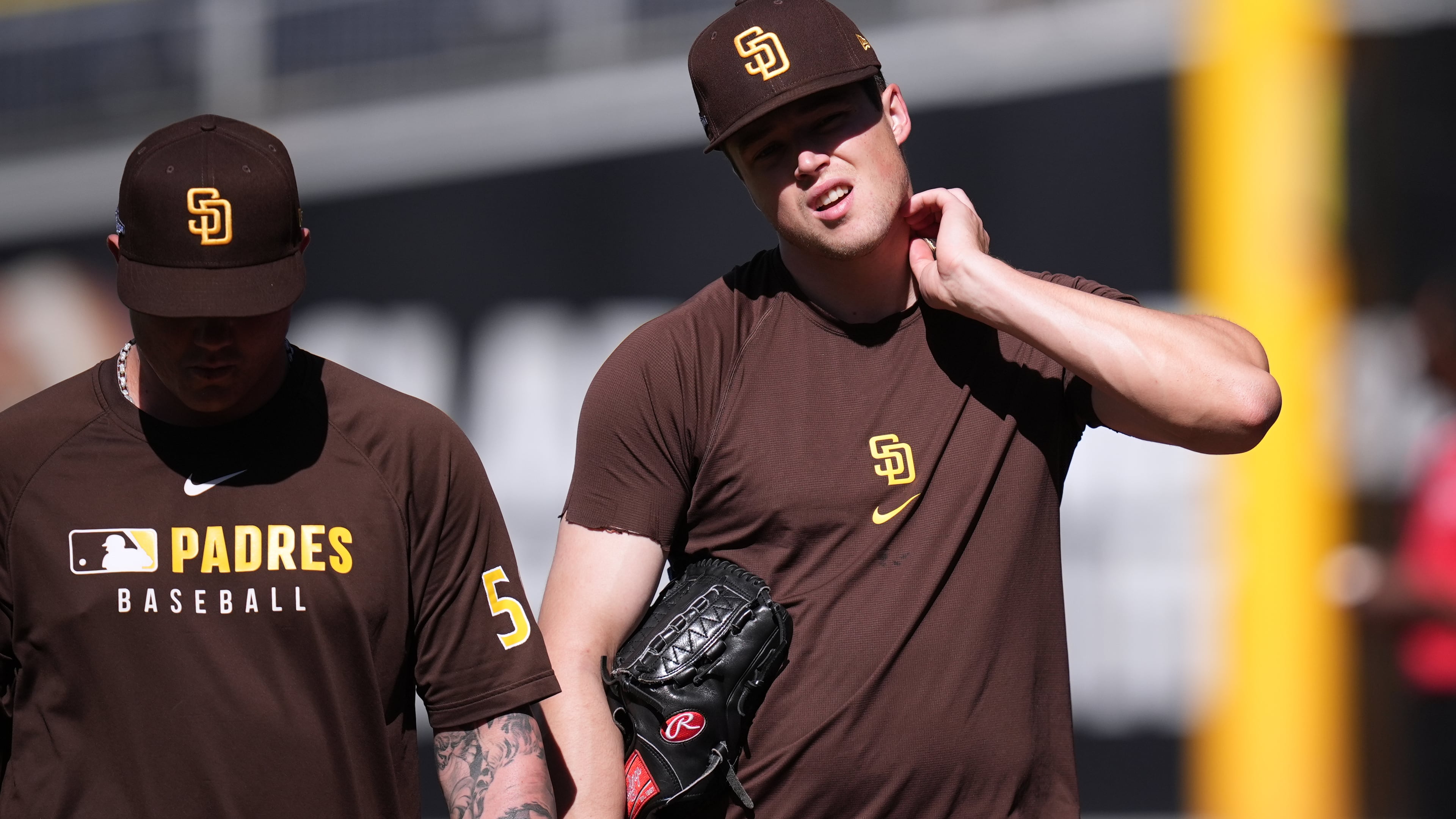 San Diego Padres pitcher Mason Miller, right, walks with pitcher Adrian Morejon during training a day before Game 3 of a National League Division Series baseball game against the Milwaukee Brewers Monday, Oct. 5, 2026, in San Diego. (AP Photo/Gregory Bull)