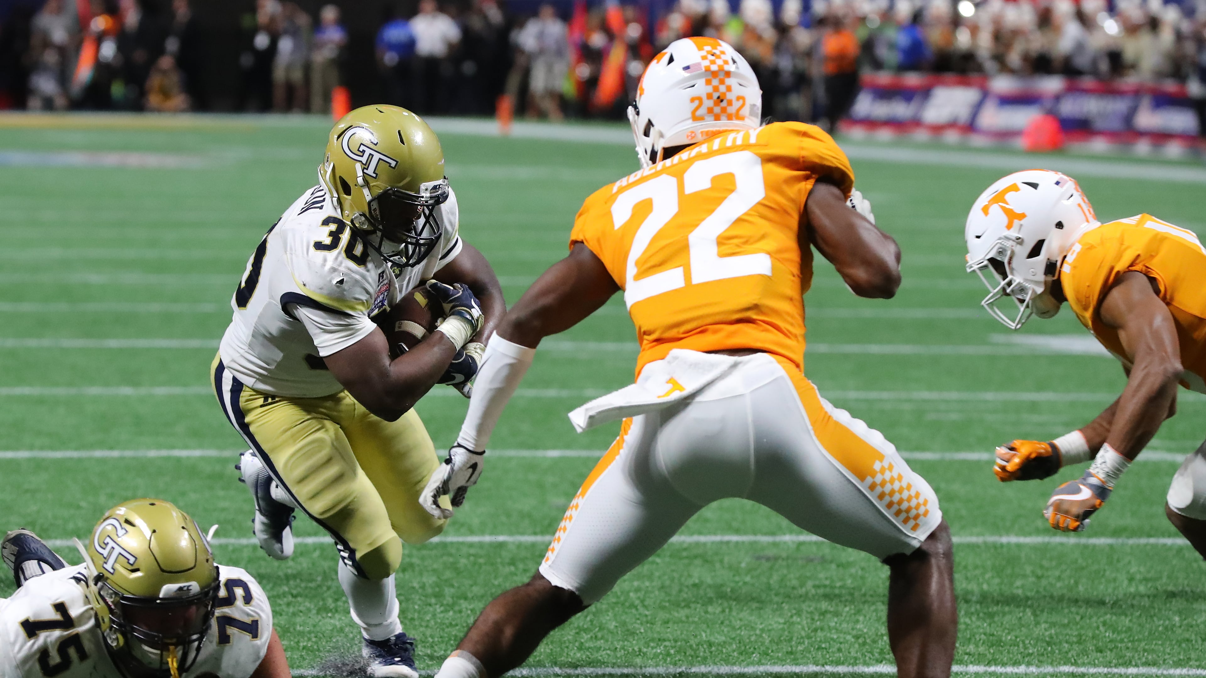Jackets running back KirVonte Benson runs for yardage setting up a go ahead touchdown to take a 14-7 lead over Tennessee during the second quarter in a NCAA college football game on Monday, September 4, 2017, in Atlanta. Curtis Compton/ccompton@ajc.com