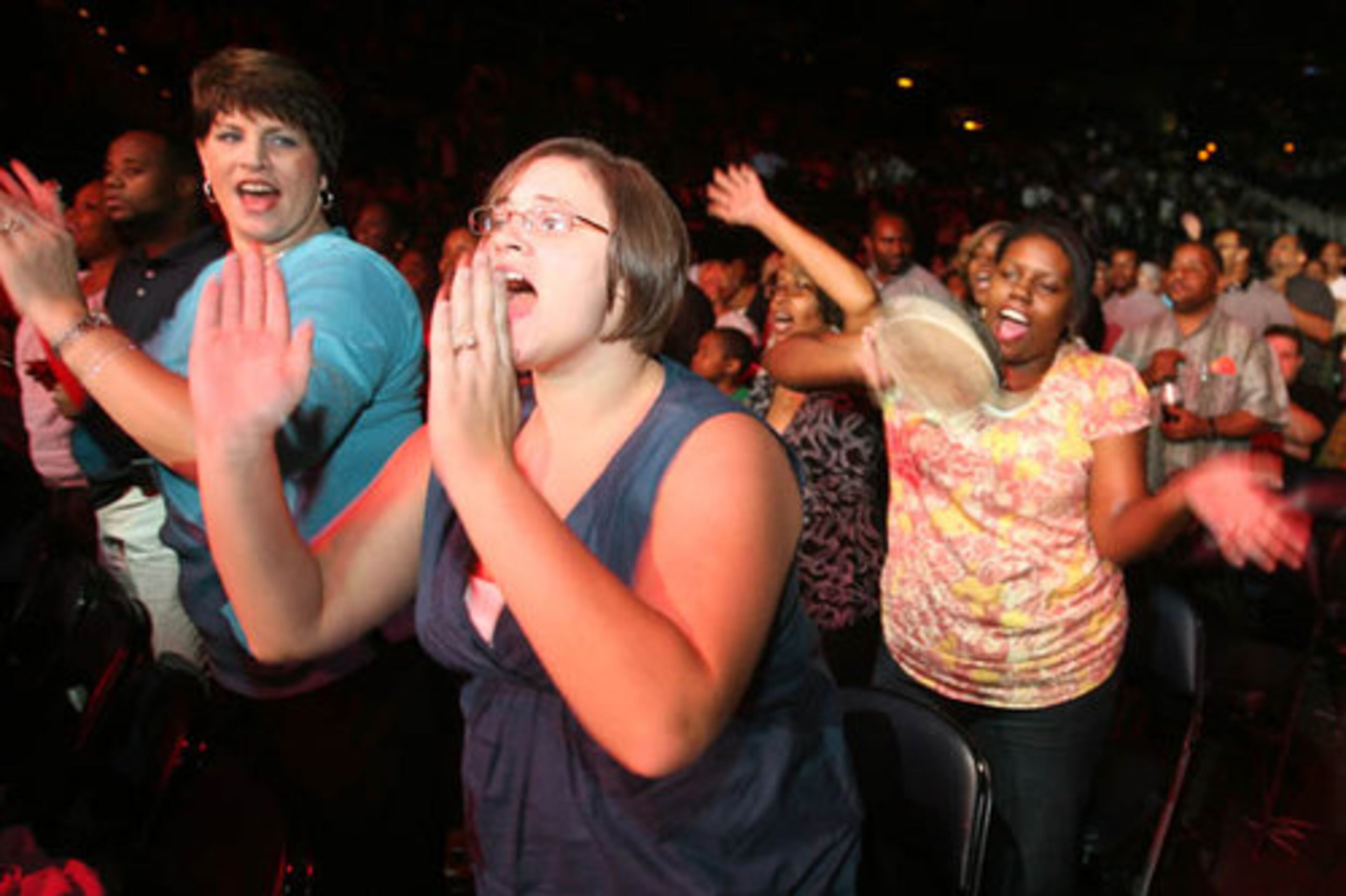From left, Adrienne Lovell, Jessie Owensby and Lisa Dixon dance in their seats. "I'm here for the pure enjoyment," Dixon said.