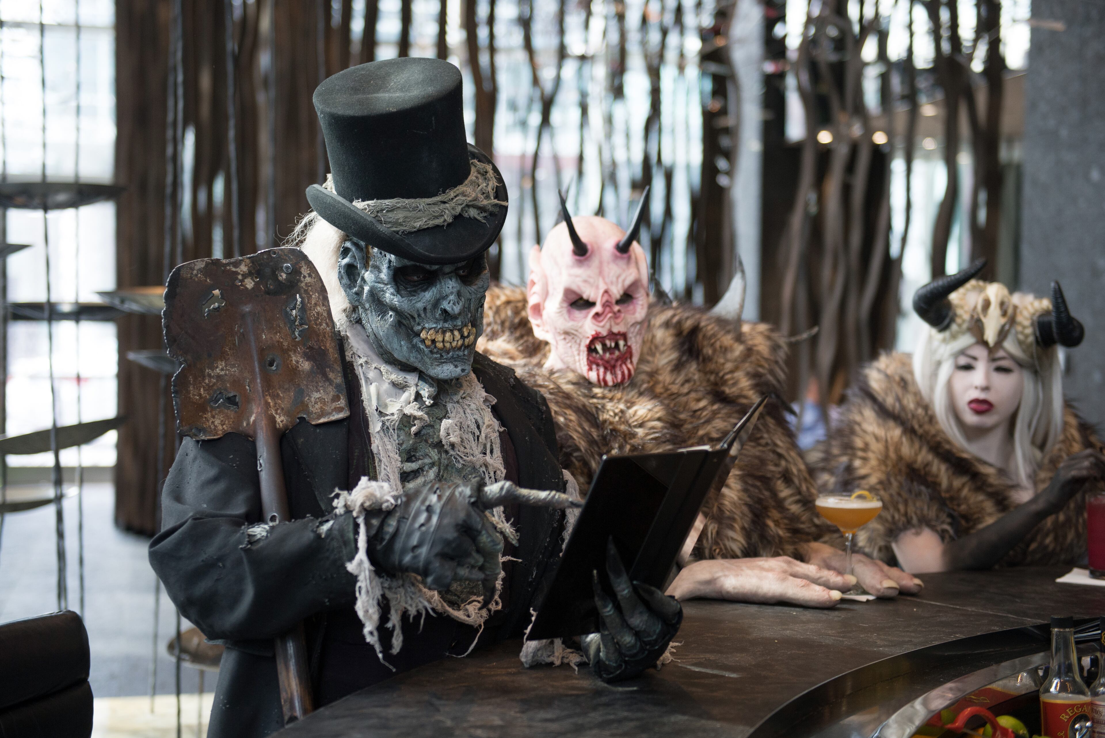 Monsters from Netherworld Haunted House in Norcross (from left) The Collector, Crampus and the Crampus Queen hang out at Living Room at W Atlanta Downtown hotel on Thursday, October 7, 2014. A self-guided, dark attraction known for its over-the-top special effects, intense make-up, costuming and stunt actors as well as unique monsters, unusual themes and chilling detail, Netherworld Haunted House is taking over the Halloween holiday this season for its 18th season. HYOSUB SHIN / HSHIN@AJC.COM