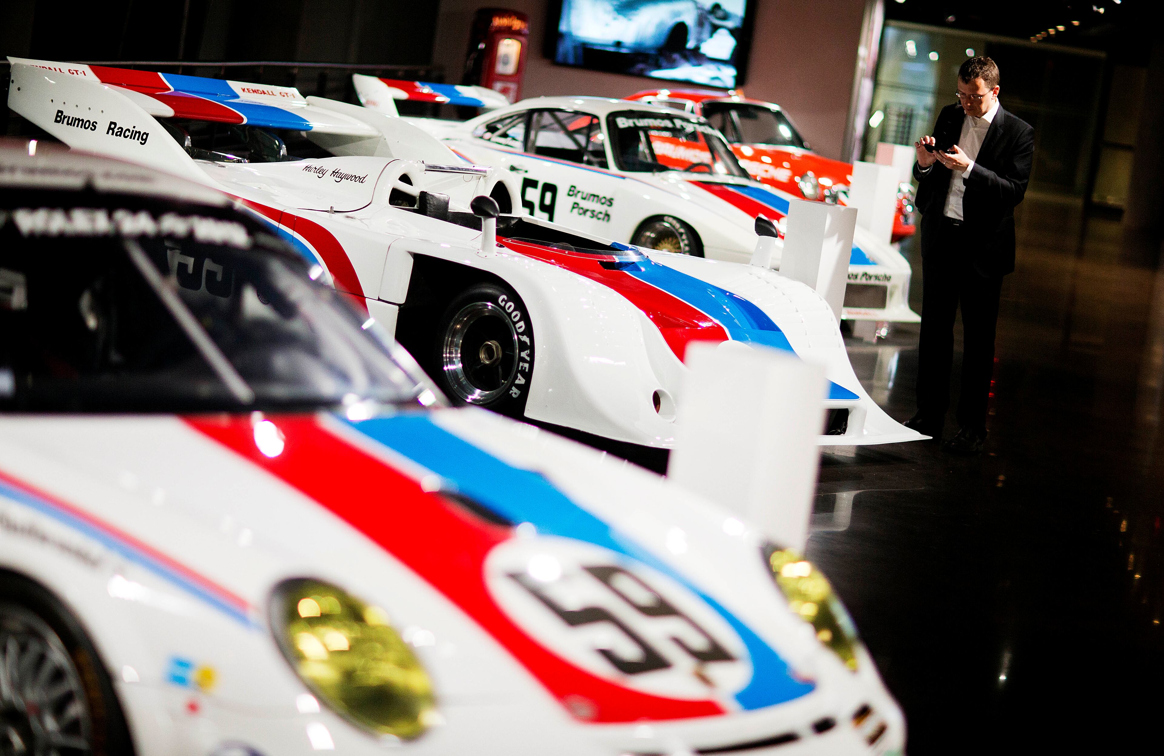 Cars sit on display in the Porsche Heritage Museum during the opening of the company's new North American headquarters, dubbed the Porsche Experience Center, Thursday, May 7, 2015, in Atlanta. The facility features a human performance fitness center, classic car gallery and restoration center in addition to a driving simulator lab and fine-dining restaurant overlooking a driver development track. (AP Photo/David Goldman)