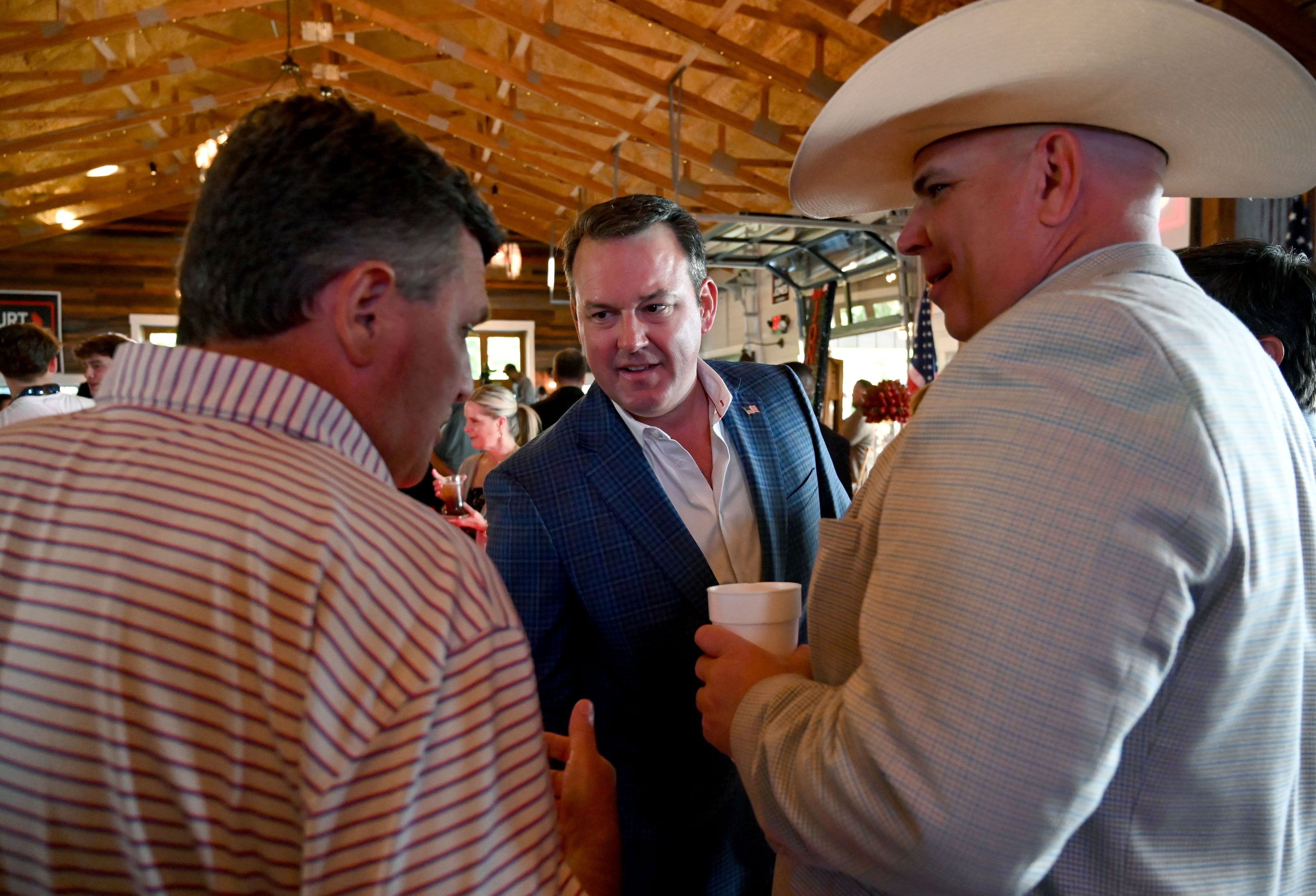 Georgia gubernatorial candidate Burt Jones greets supporters as he arrives for his election night party at The Rivers Ranch during the 2026 Georgia primary elections Tuesday, May 19, 2026, in Jackson. (Hyosub Shin/AJC)