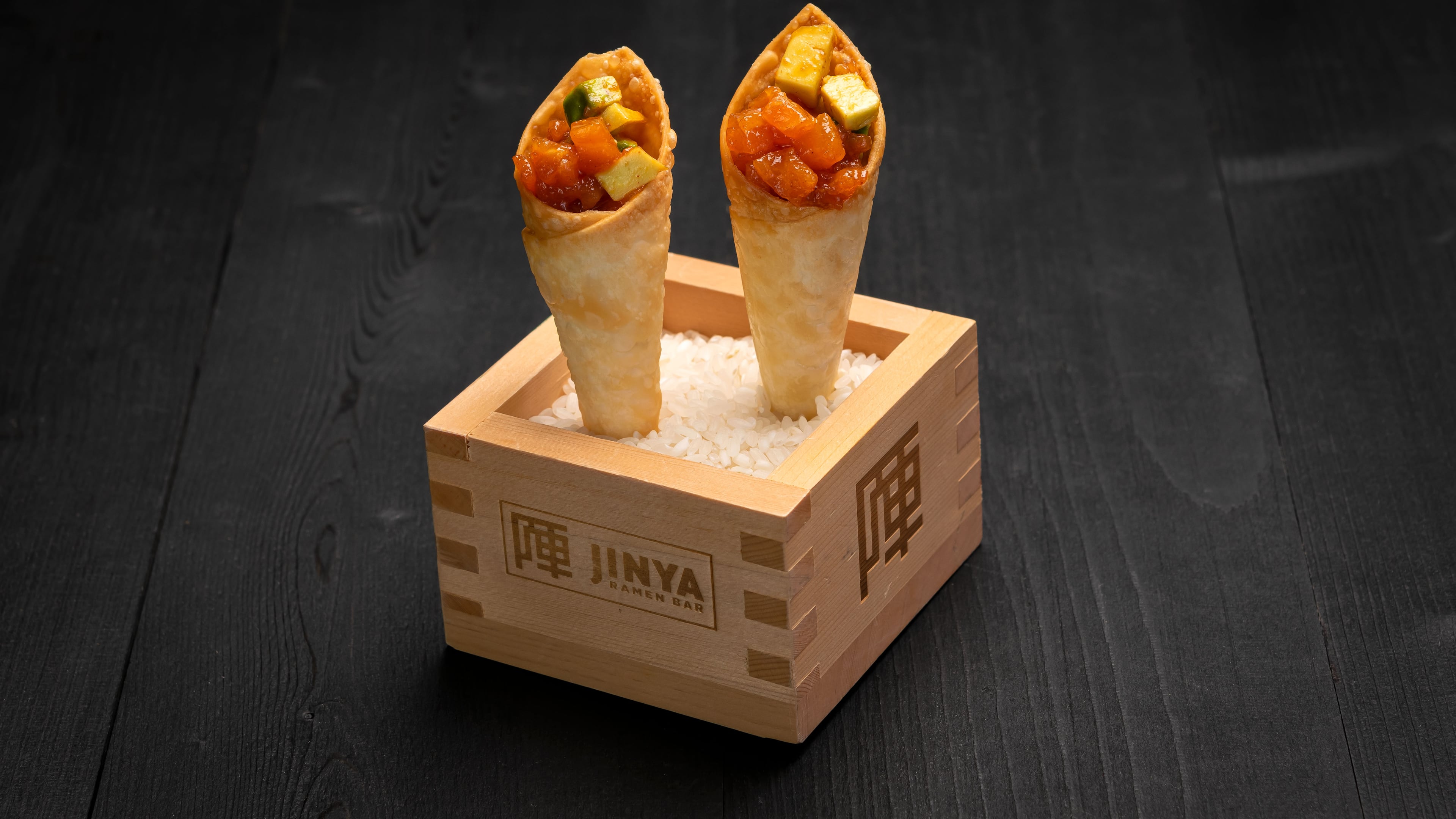 The spicy tuna and salmon cones at Jinya Ramen Bar provide a brittle munch, a meaty chew and cool creamy heat, all in one bite. Courtesy of Jinya Ramen Bar