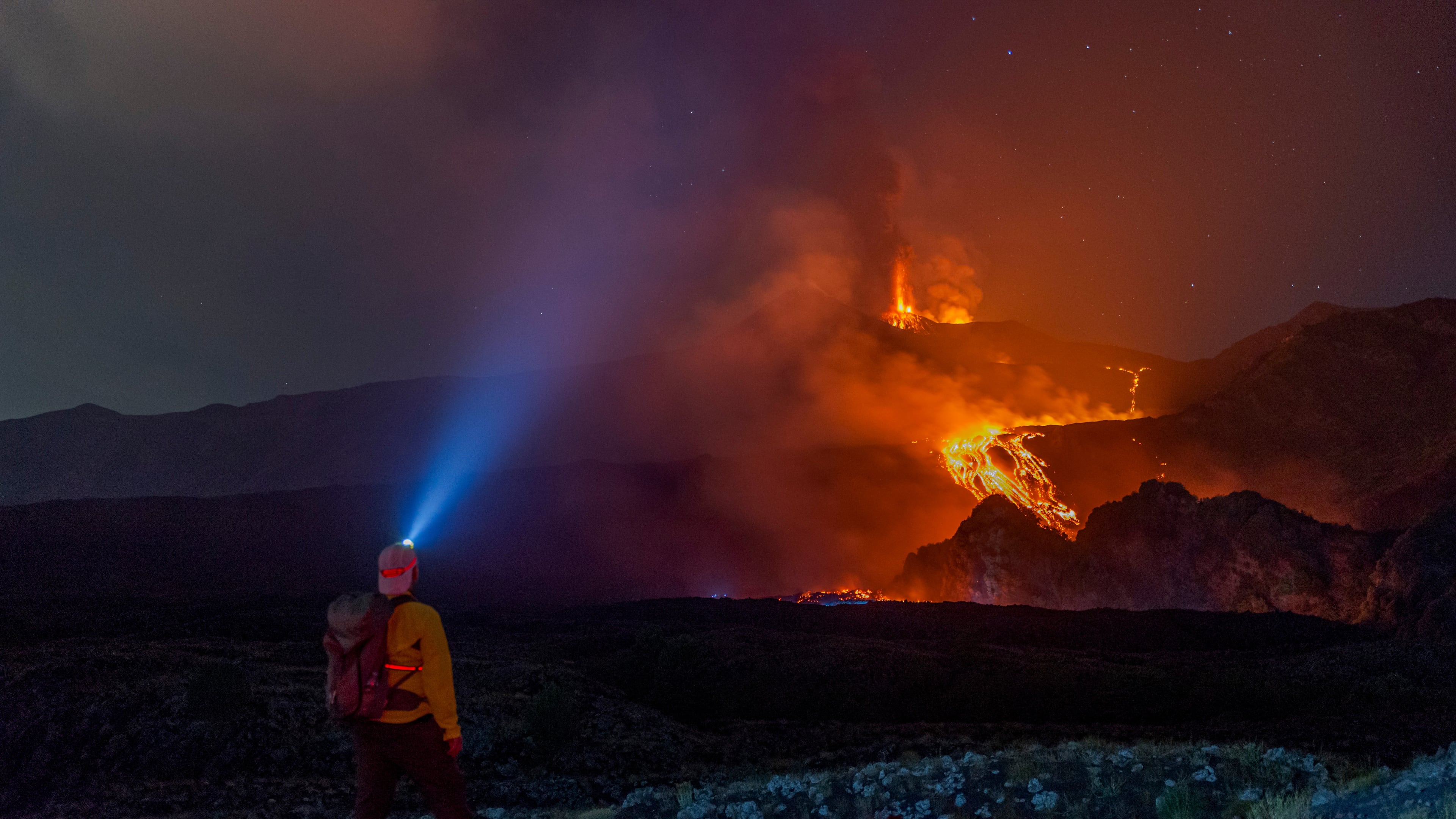 Eruptive activity continues on Mount Etna, where lava flows continue to descend on the slopes of the volcano, as seen from Mareneve near Catania, Italy, Thursday, Aug. 13, 2026. (AP Photo/Salvatore Allegra)