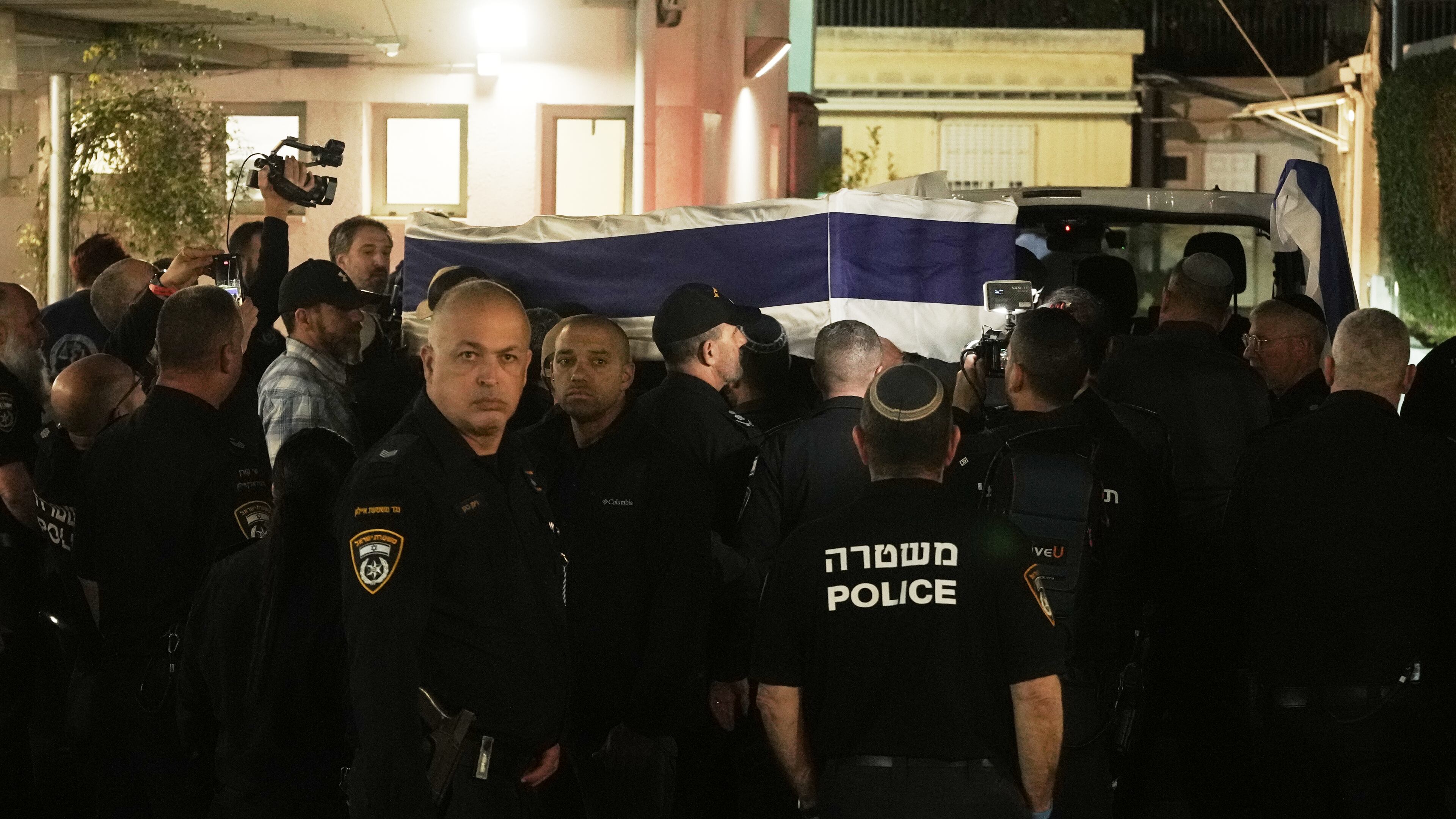 The coffin with remains of Israeli hostage Ran Gvili, last to be recovered from Gaza, arrives to the Abu Kabir Forensic Institute in Tel Aviv, Israel, Monday, Jan. 26, 2026. (AP Photo/Mahmoud Illean)