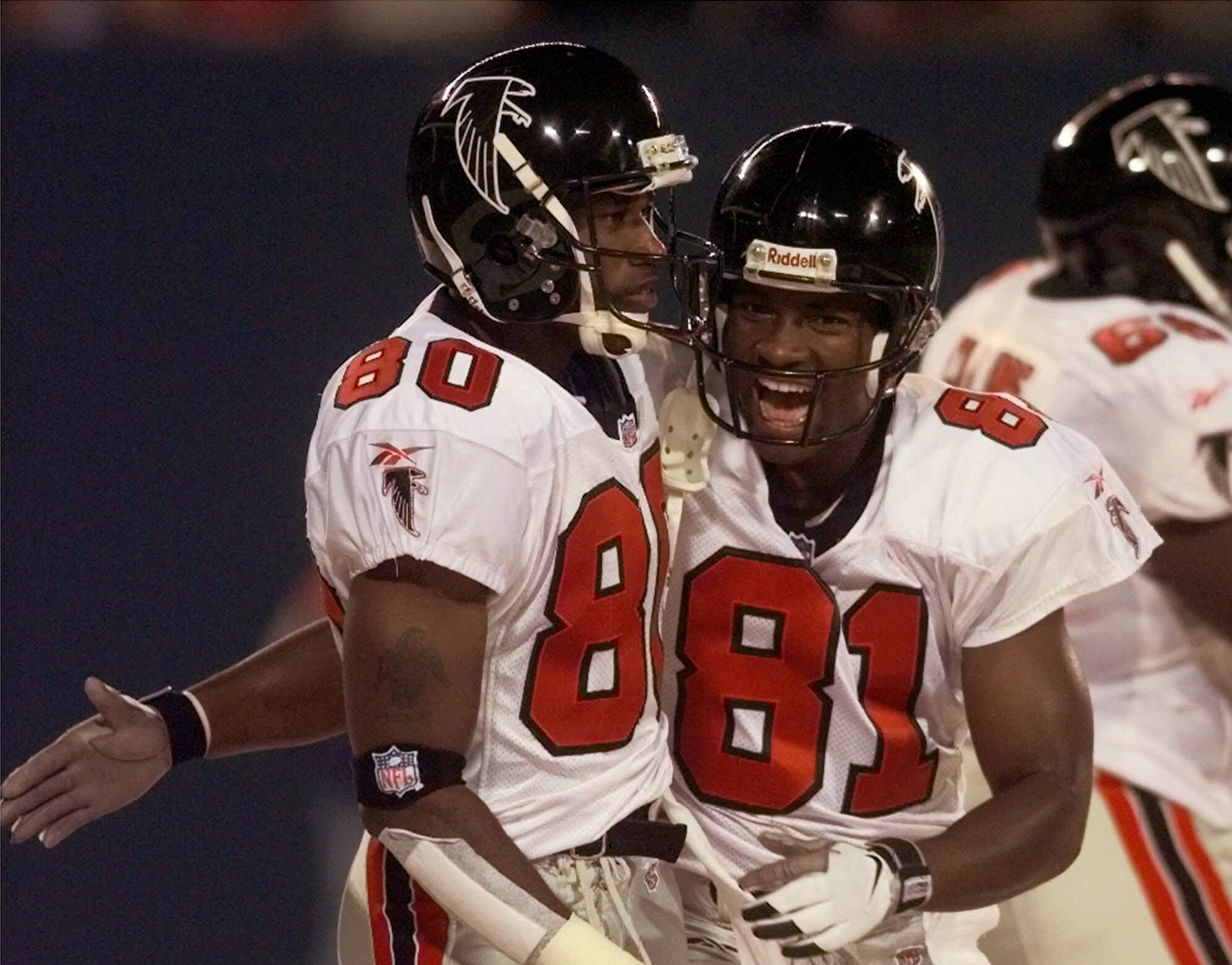 Atlanta Falcons Terance Mathis, right, congratulates fellow wide receiver Tony Martin after he caught a first quarter touchdown pass from quarterback Chris Chandler against the New York Giants Sunday Oct. 11, 1998 in East Rutherford, N.J. (AP Photo/Mark Lennihan)