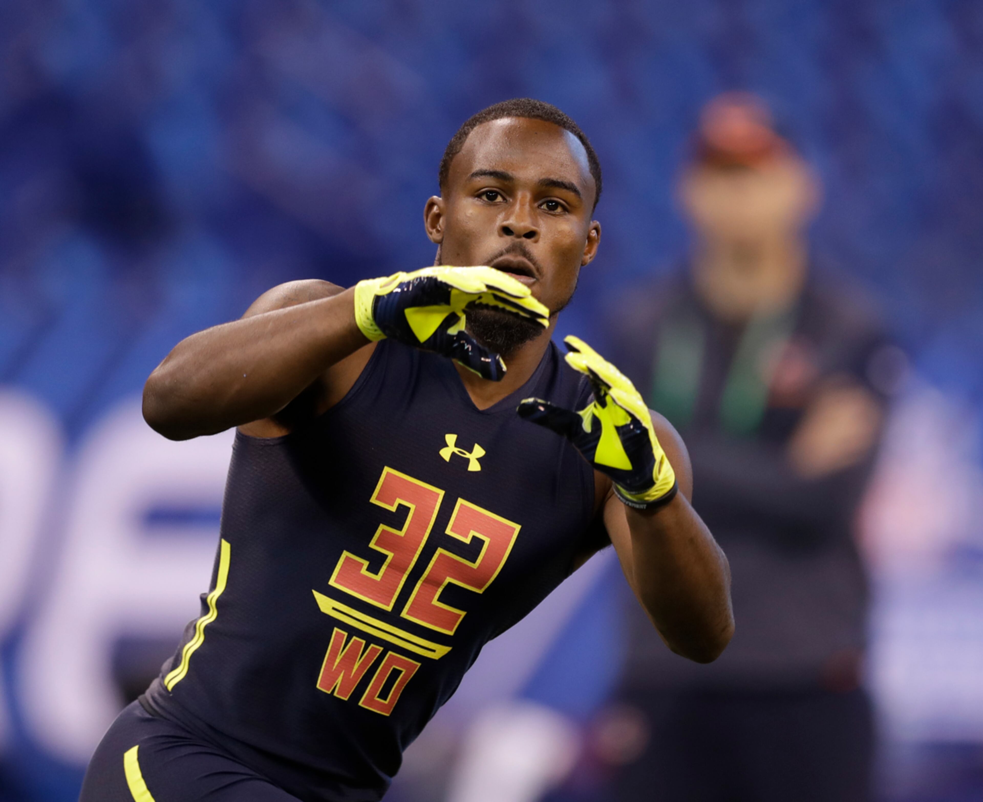 Georgia wide receiver Isaiah Mckenzie runs a drill at the NFL football scouting combine Saturday, March 4, 2017, in Indianapolis. (AP Photo/David J. Phillip)