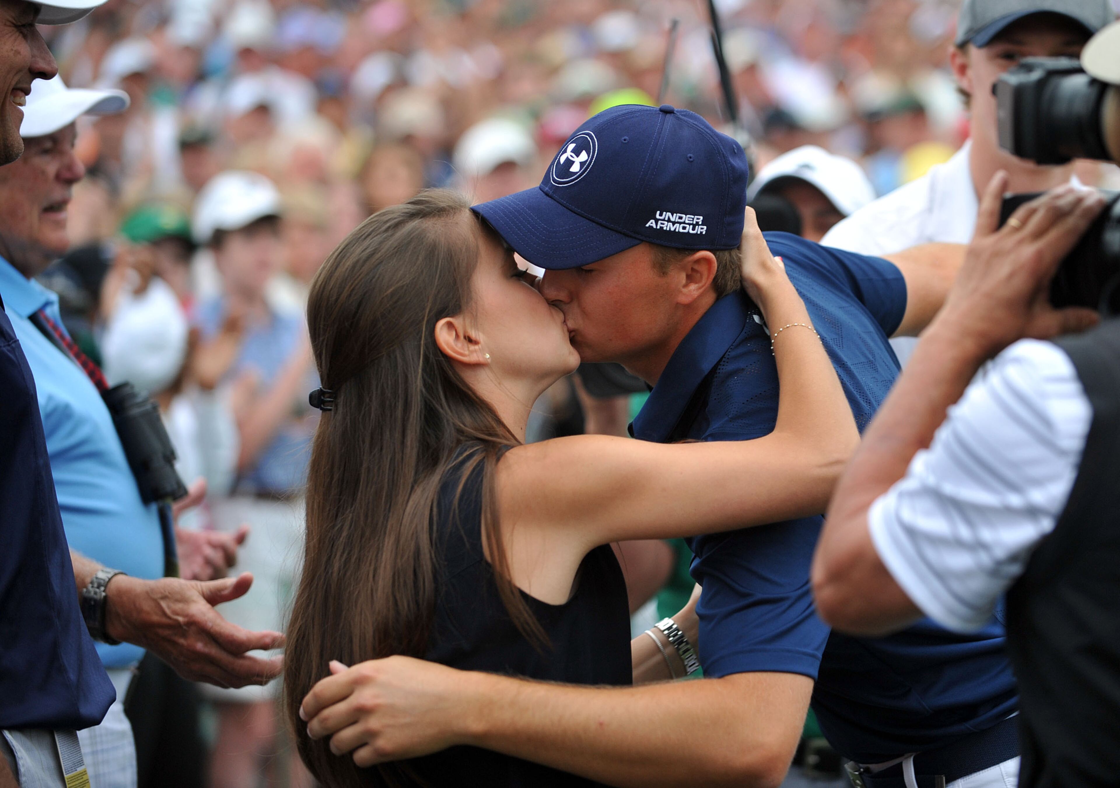 Jordan Spieth kisses his girlfriend, Annie Verret, after winning the 79th Masters Golf Tournament.Photos from the final round at the Masters Golf Tournament, Sunday, April 12, 2015. KENT D. JOHNSON/ KDJOHNSON@AJC.COM