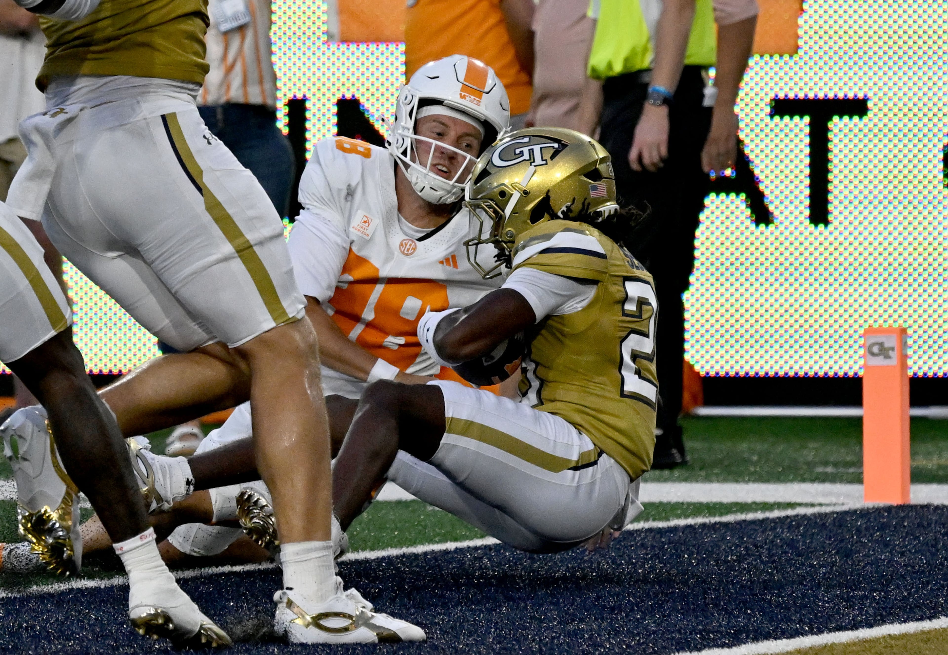 Georgia Tech defensive back Elgin Sessions returns a blocked punt for a touchdown past Tennessee punter Jackson Ross during the first half of an NCAA college football game at Bobby Dodd Stadium on Saturday, Sept. 12, 2026, in Atlanta.(Hyosub Shin/AJC)